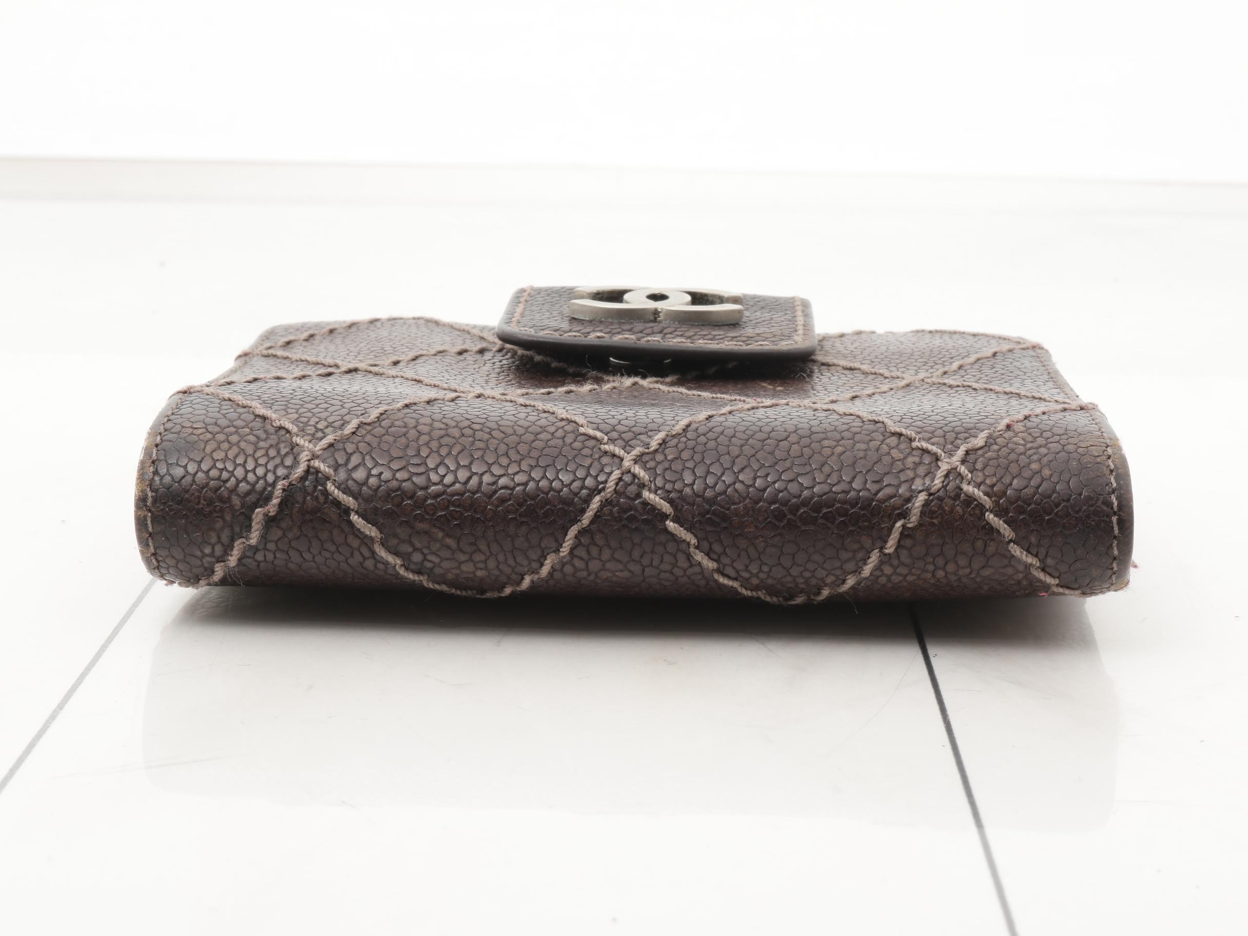Tri-fold wallet, with sticker, serial number in the teens. — view 3
