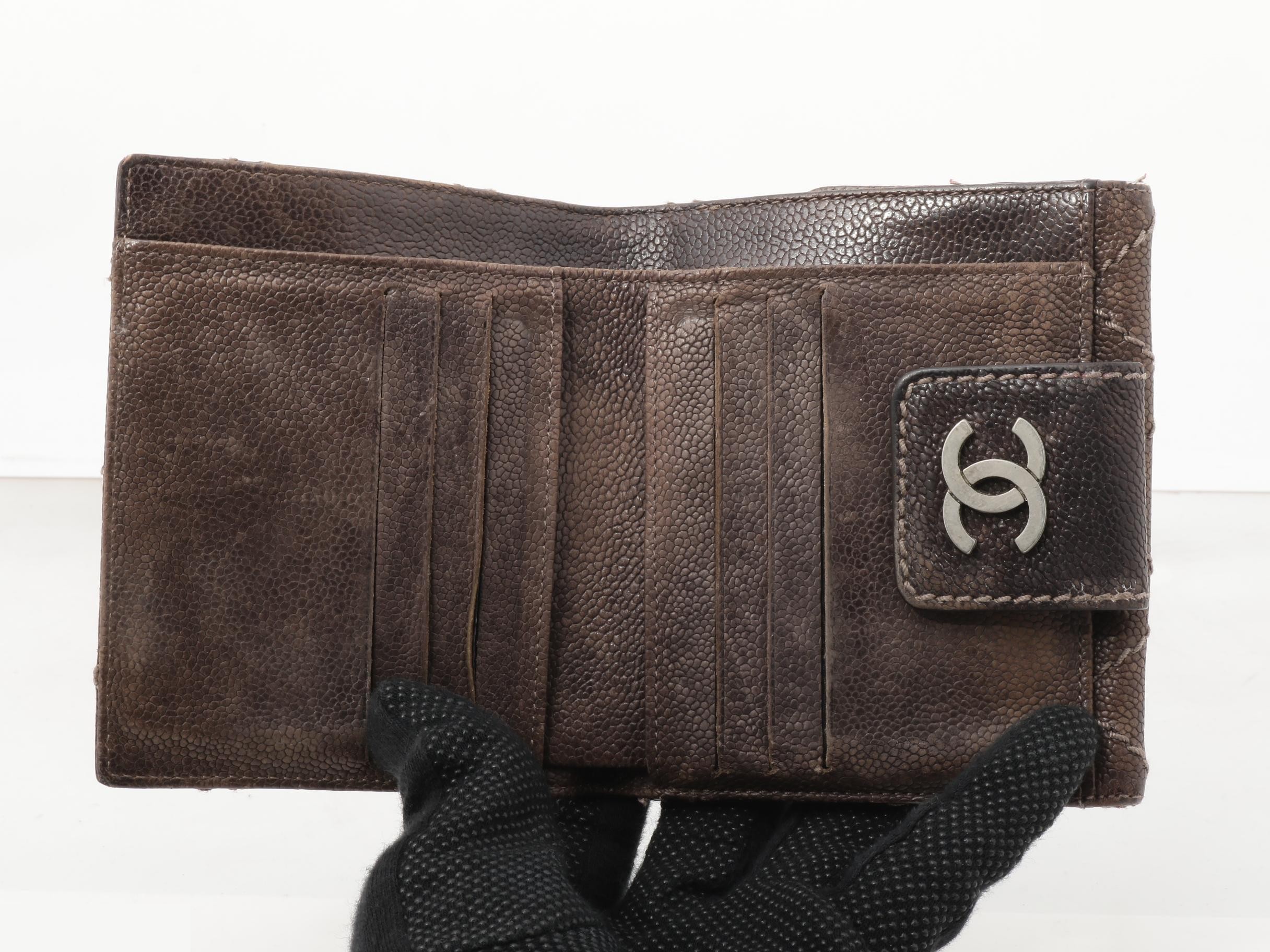Tri-fold wallet, with sticker, serial number in the teens. — view 4