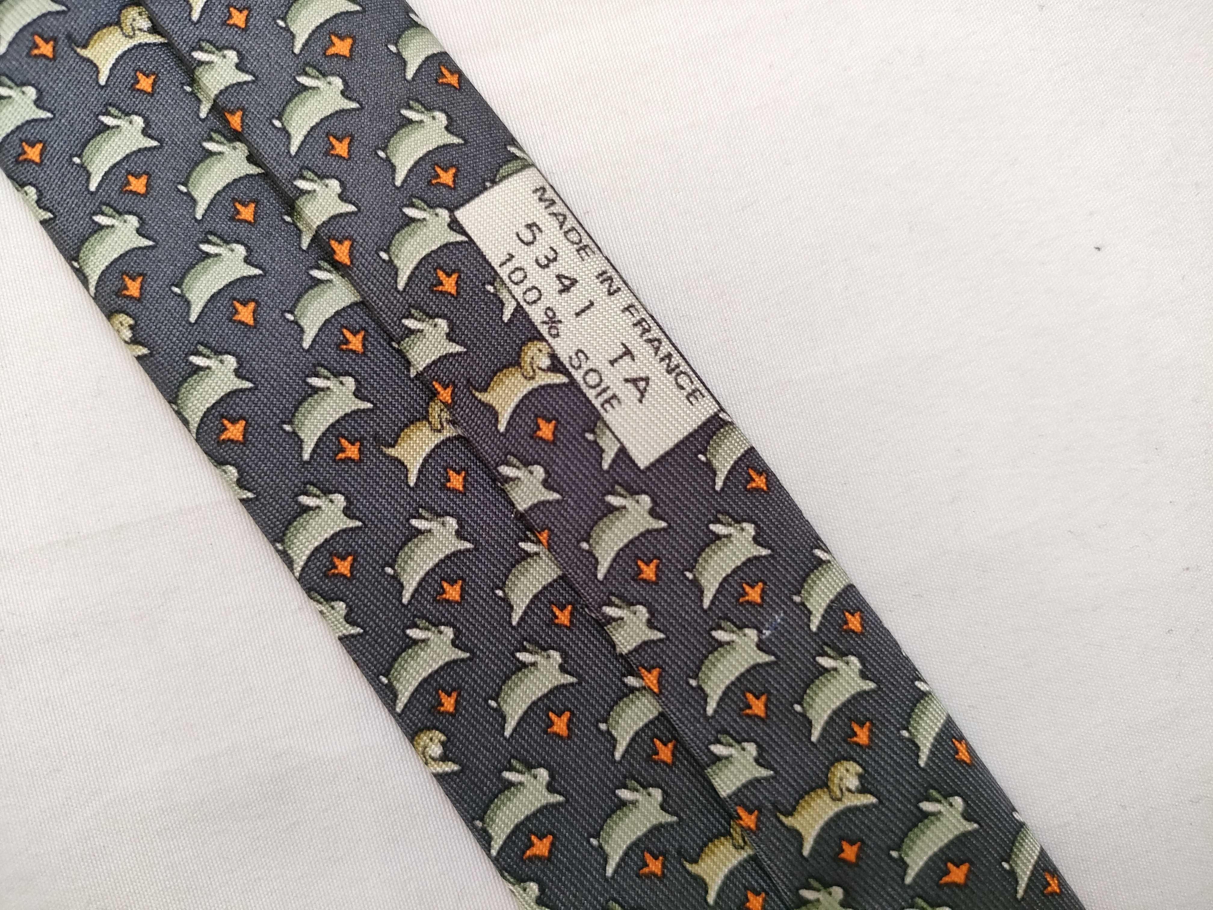 silk tie with animal print, navy blue, and other accessories. — view 5