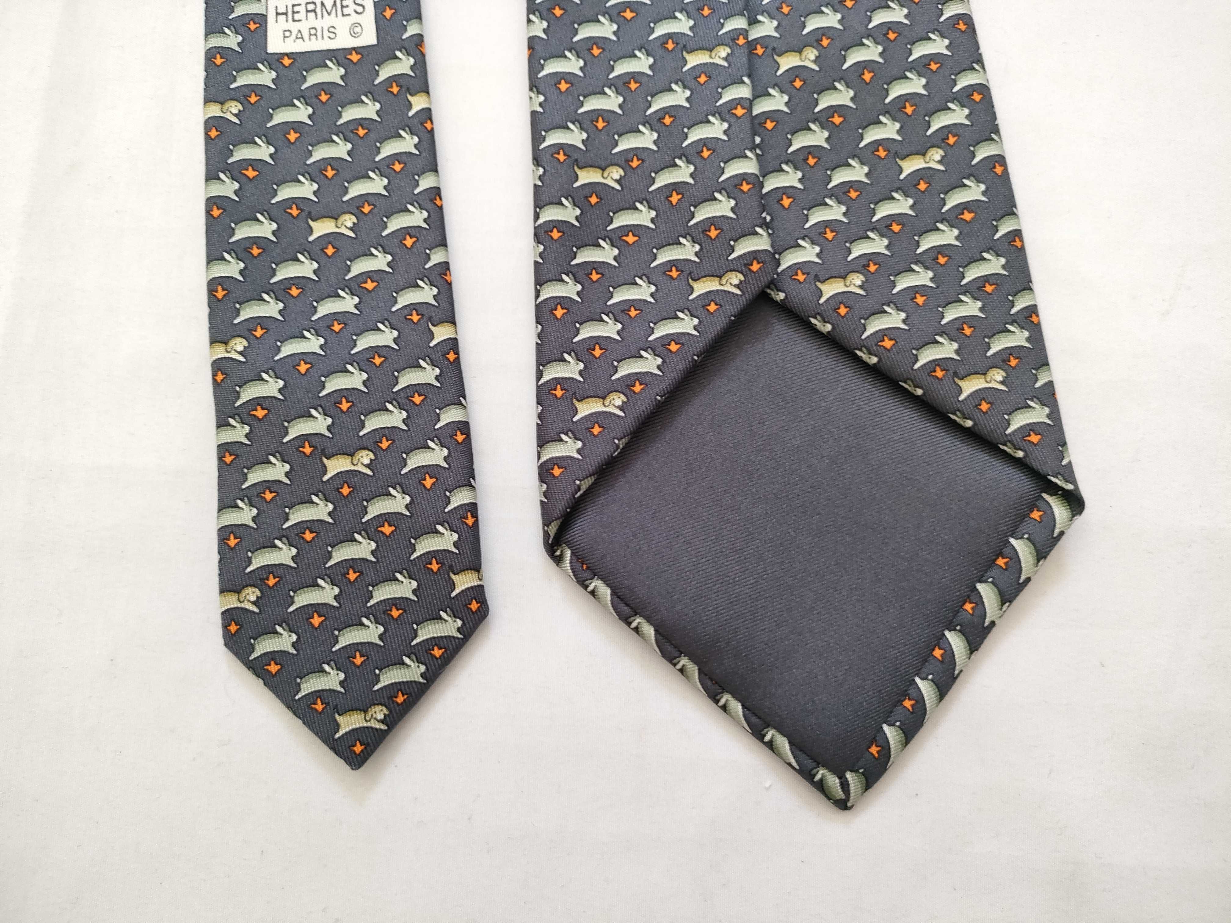 silk tie with animal print, navy blue, and other accessories. — view 6