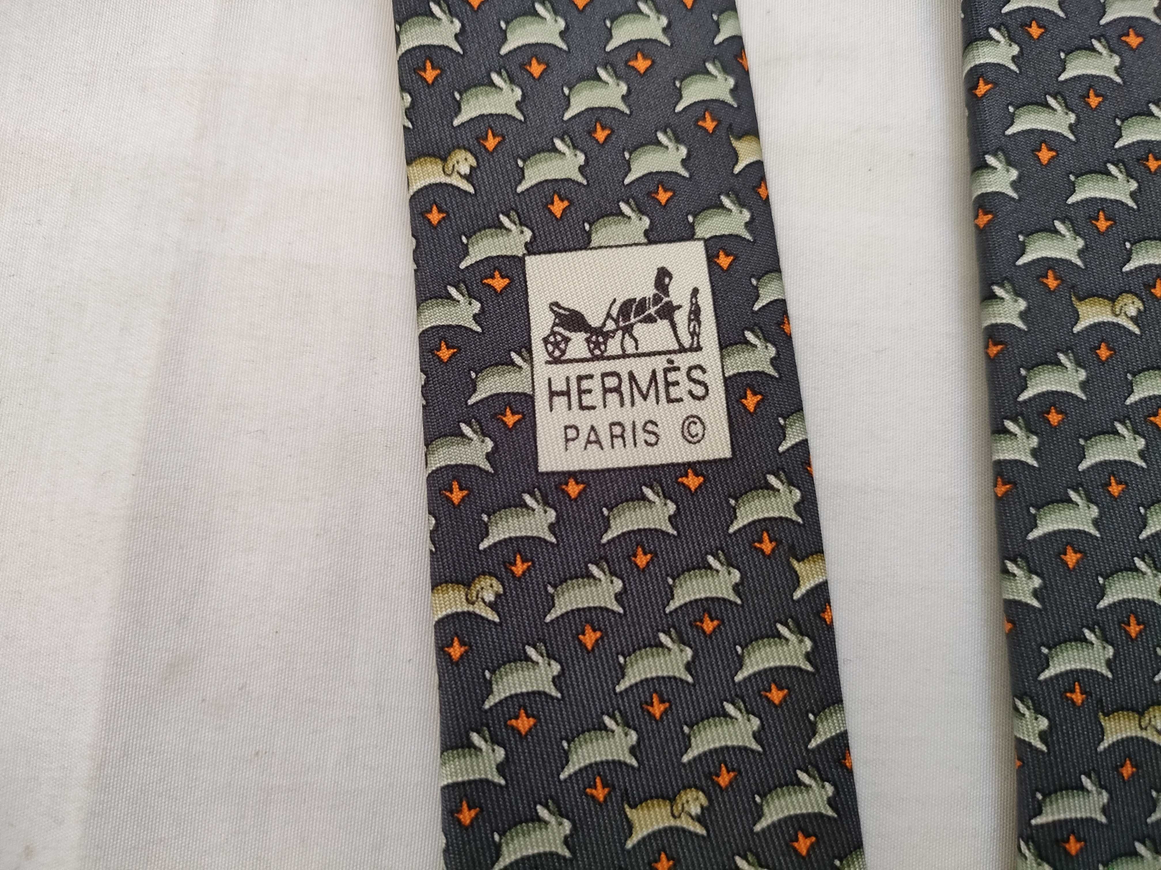 silk tie with animal print, navy blue, and other accessories. — view 7