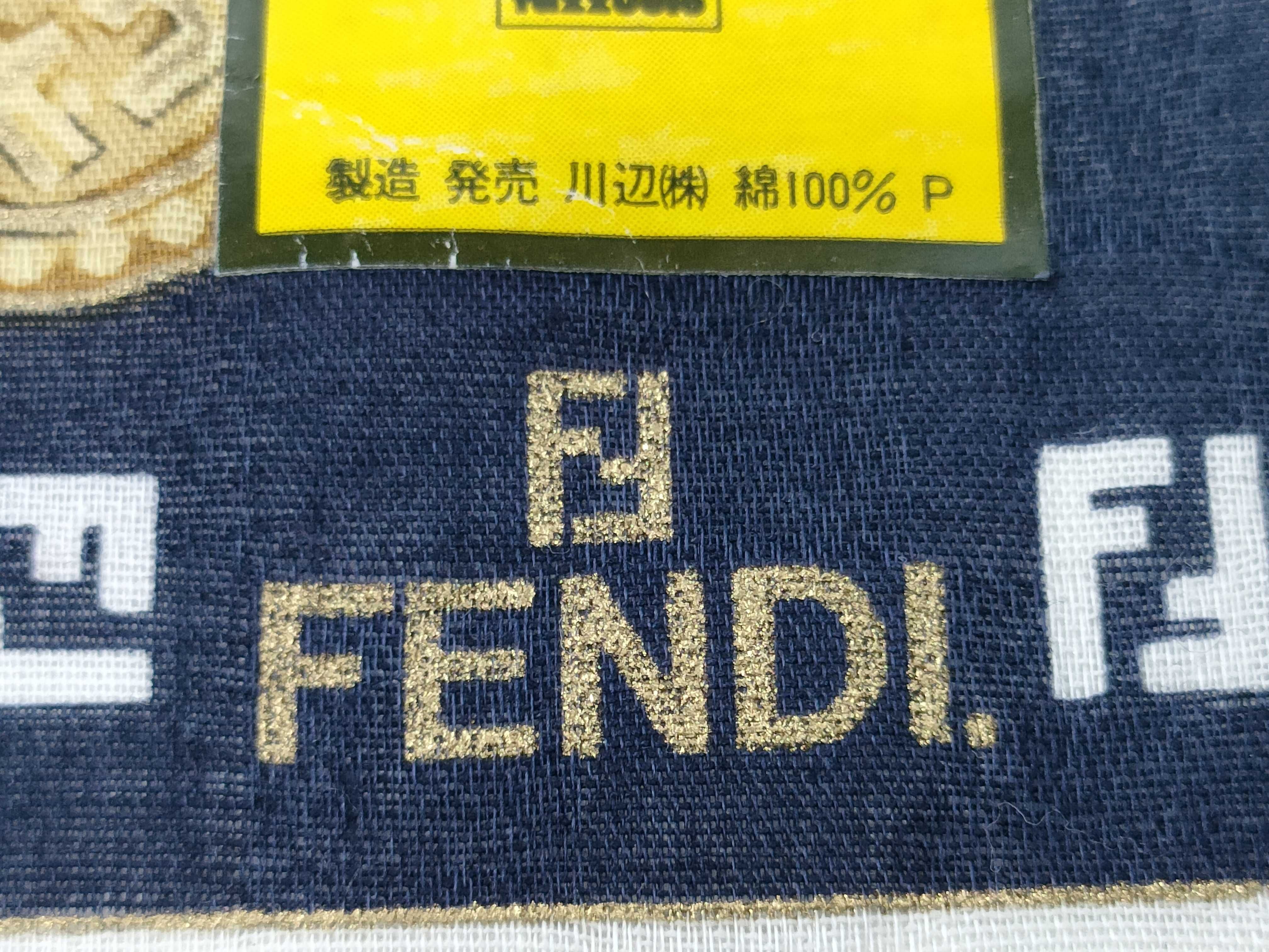 handkerchief scarf with sticker, border logo, FF Zucca pattern, chain, coin, and other accessories. — view 4