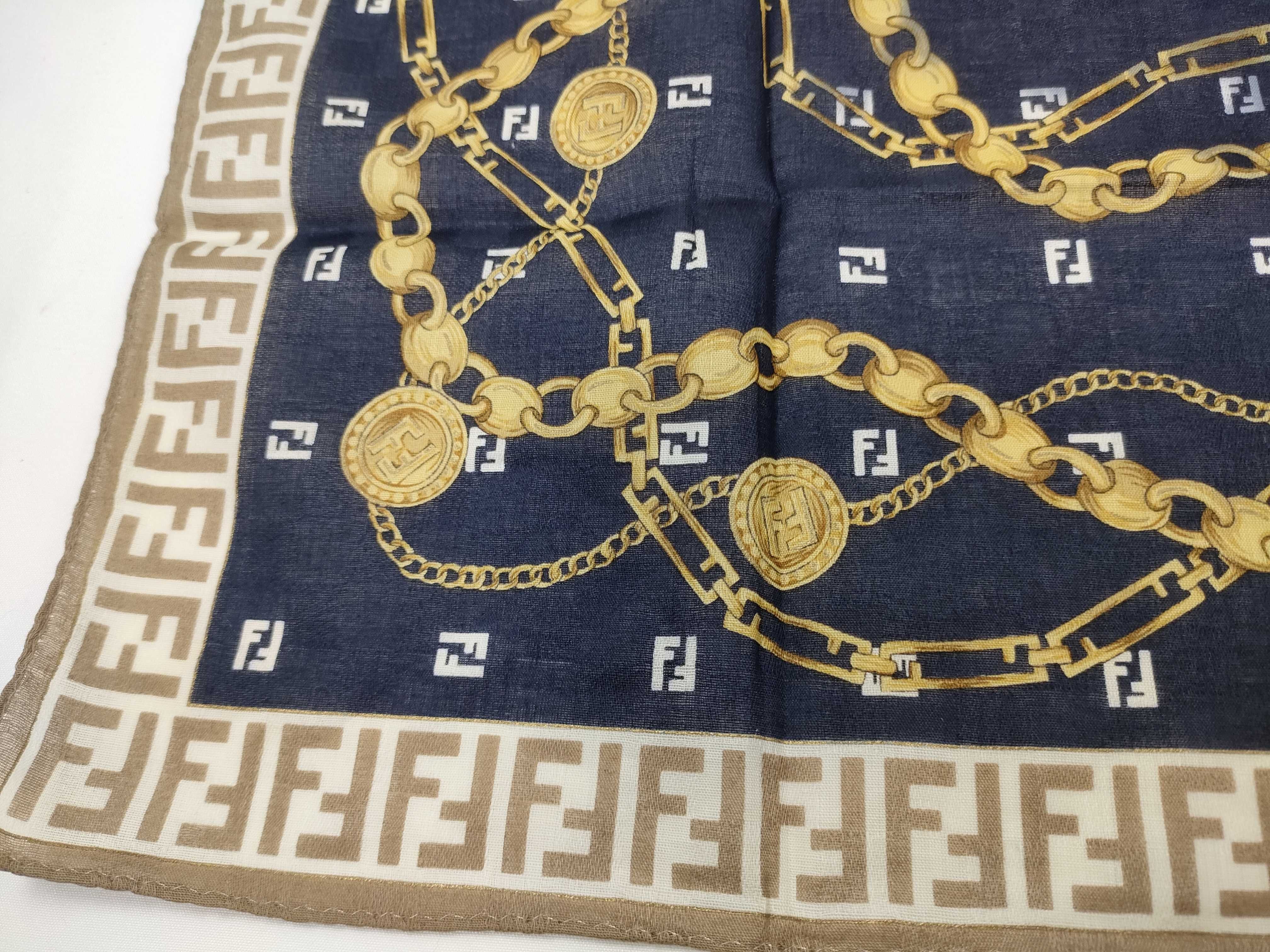 handkerchief scarf with sticker, border logo, FF Zucca pattern, chain, coin, and other accessories. — view 5