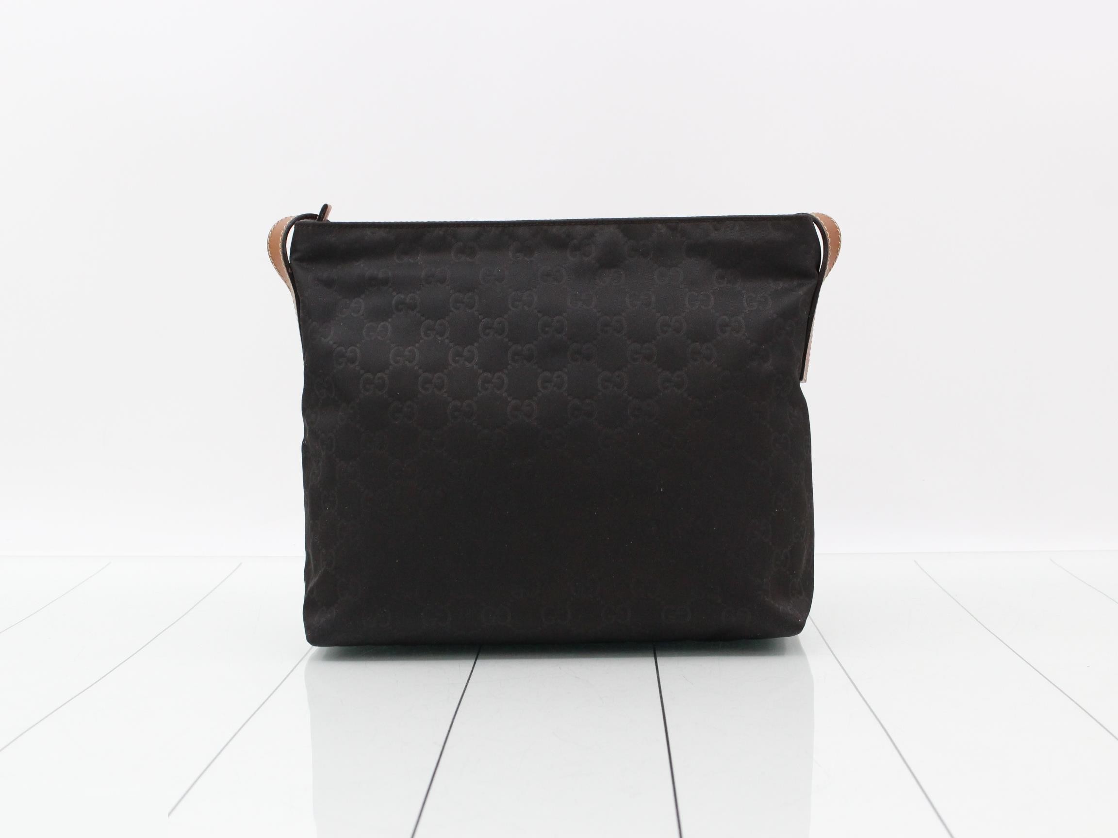 Nylon and leather shoulder bag with GG pattern. — view 2