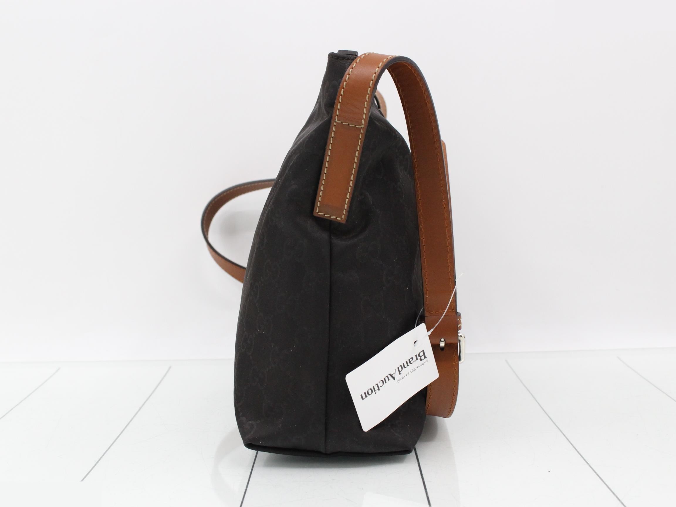 Nylon and leather shoulder bag with GG pattern. — view 4