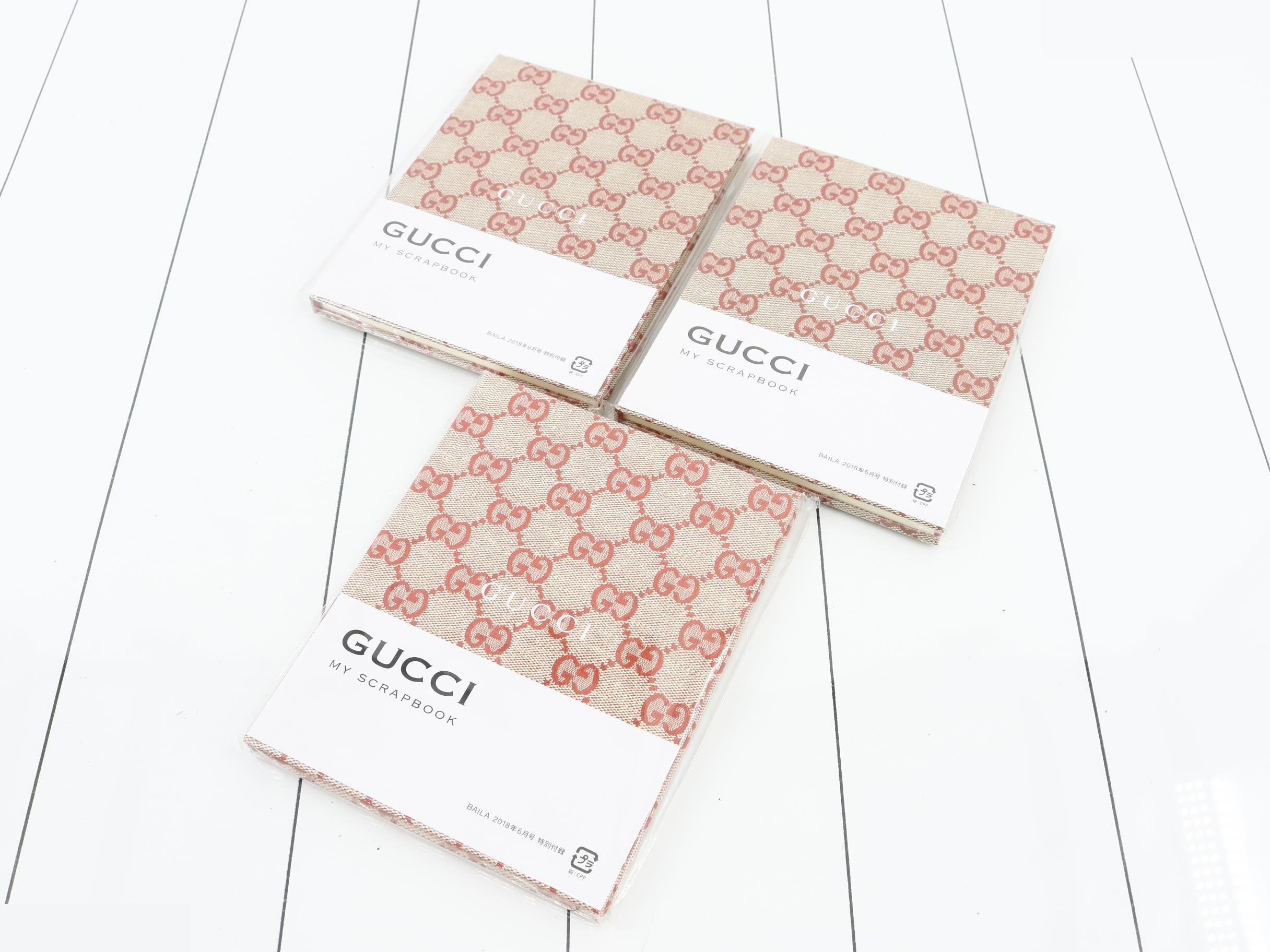 Unused Gucci novelty notebooks, set of 3.