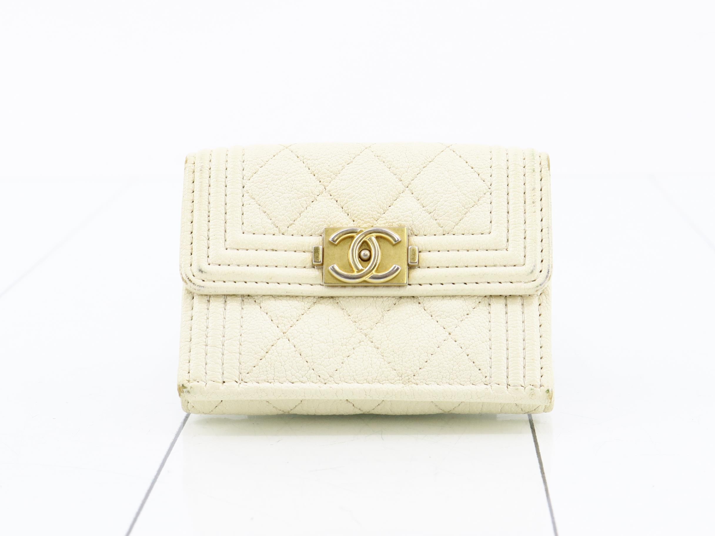 Gold hardware, caviar leather (bags) and wallets