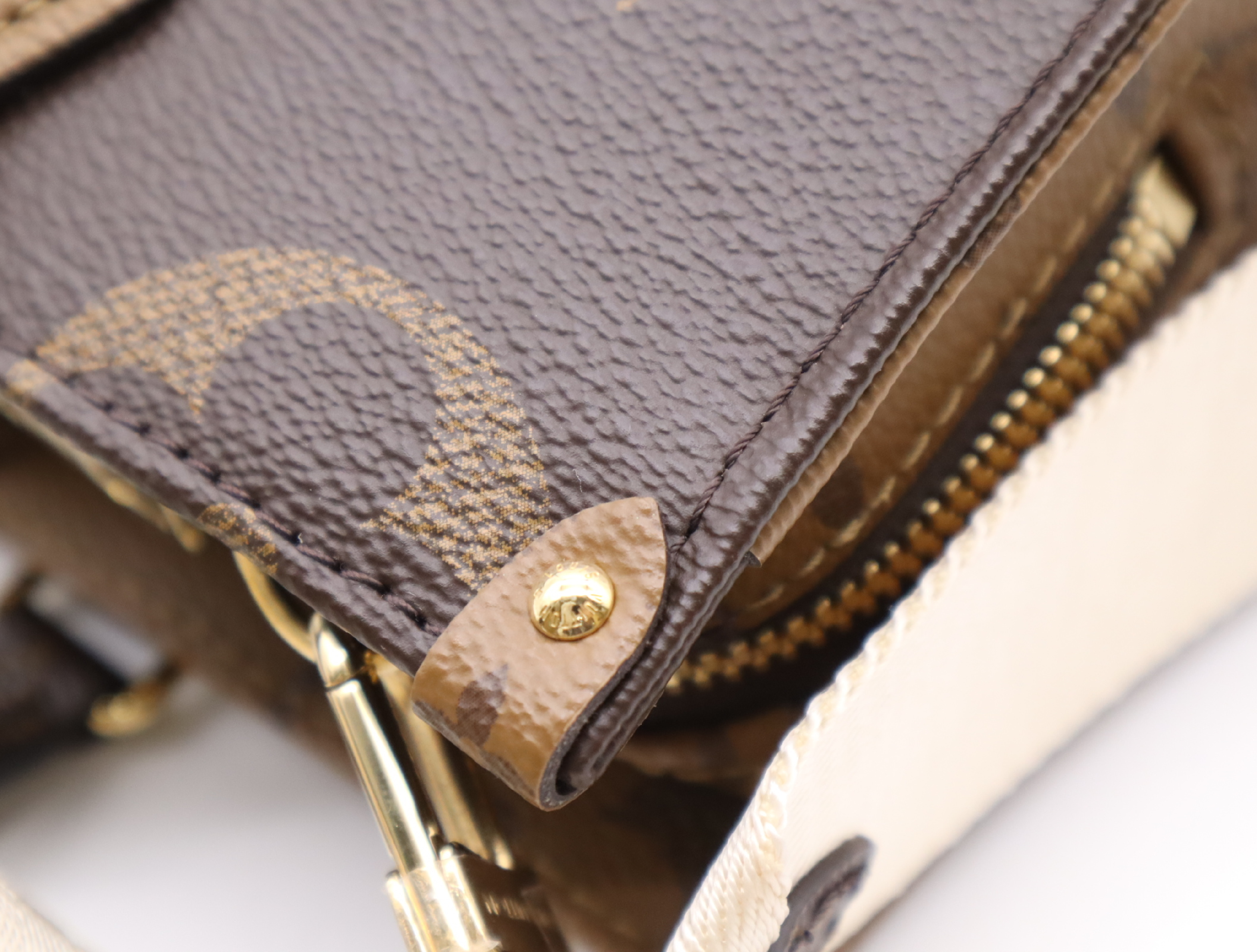 M46653 Monogram Giant Reverse OnTheGo EW Handbag with Shoulder Strap, Coin Case, Dust Bag, and Box — view 11