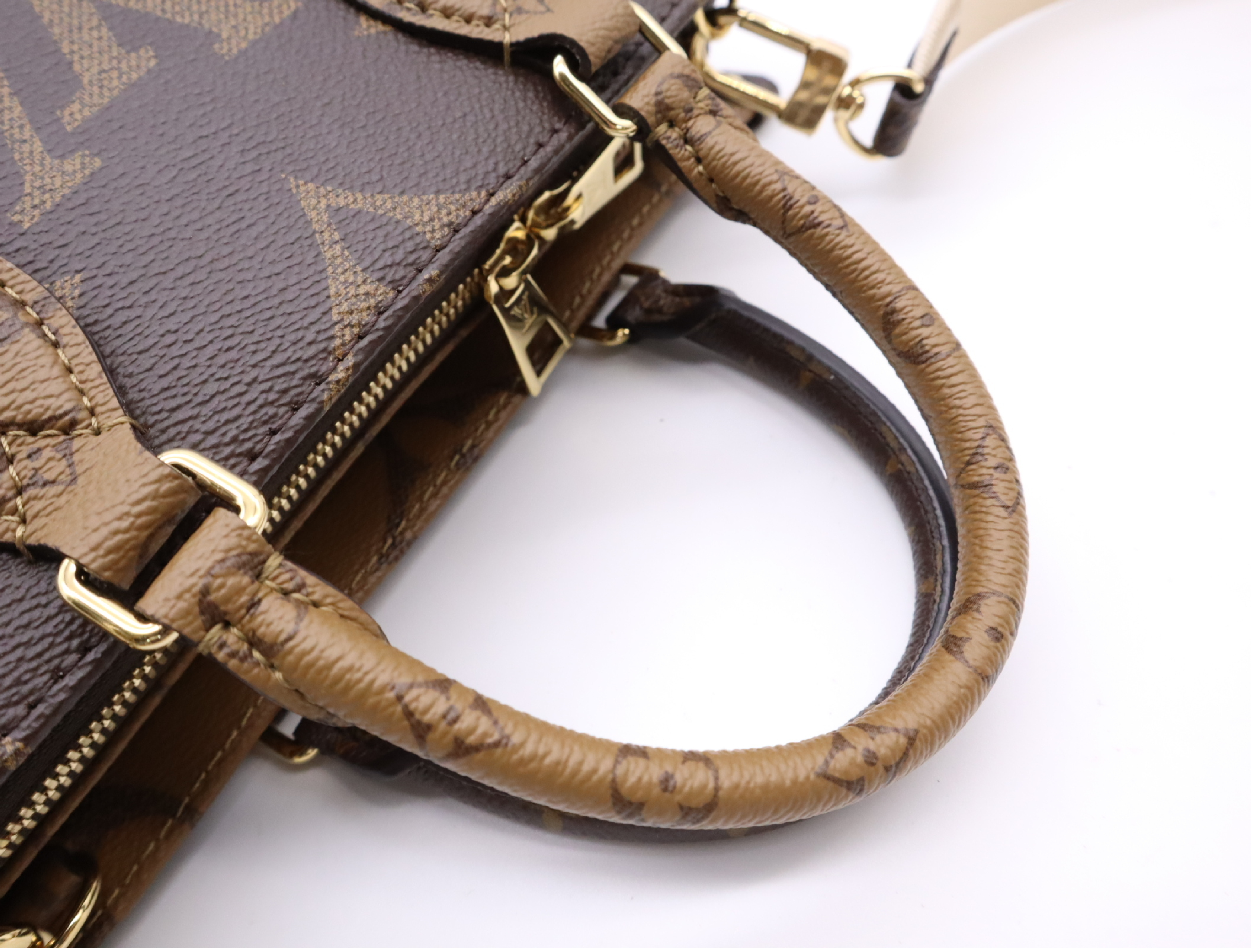 M46653 Monogram Giant Reverse OnTheGo EW Handbag with Shoulder Strap, Coin Case, Dust Bag, and Box — view 13