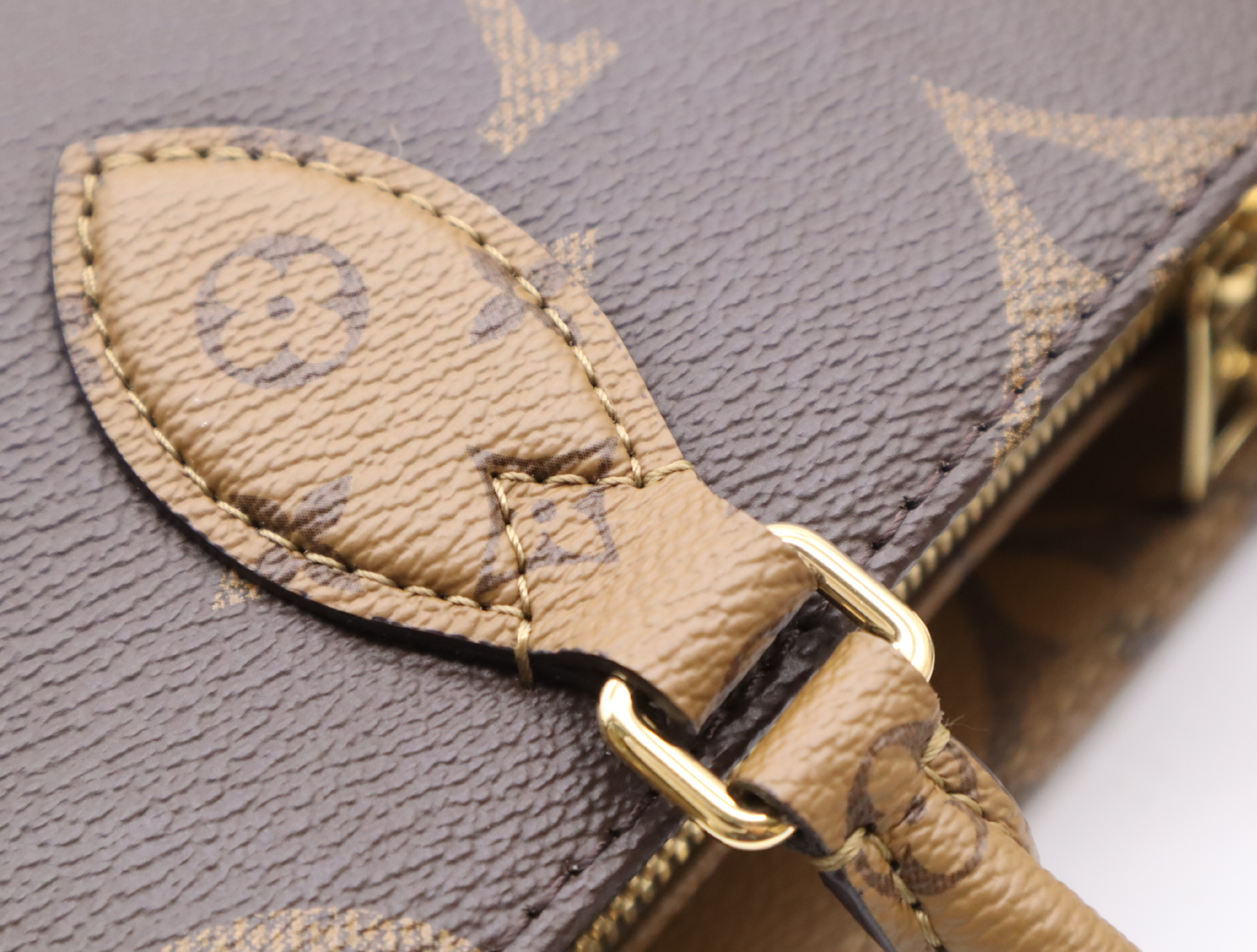 M46653 Monogram Giant Reverse OnTheGo EW Handbag with Shoulder Strap, Coin Case, Dust Bag, and Box — view 9