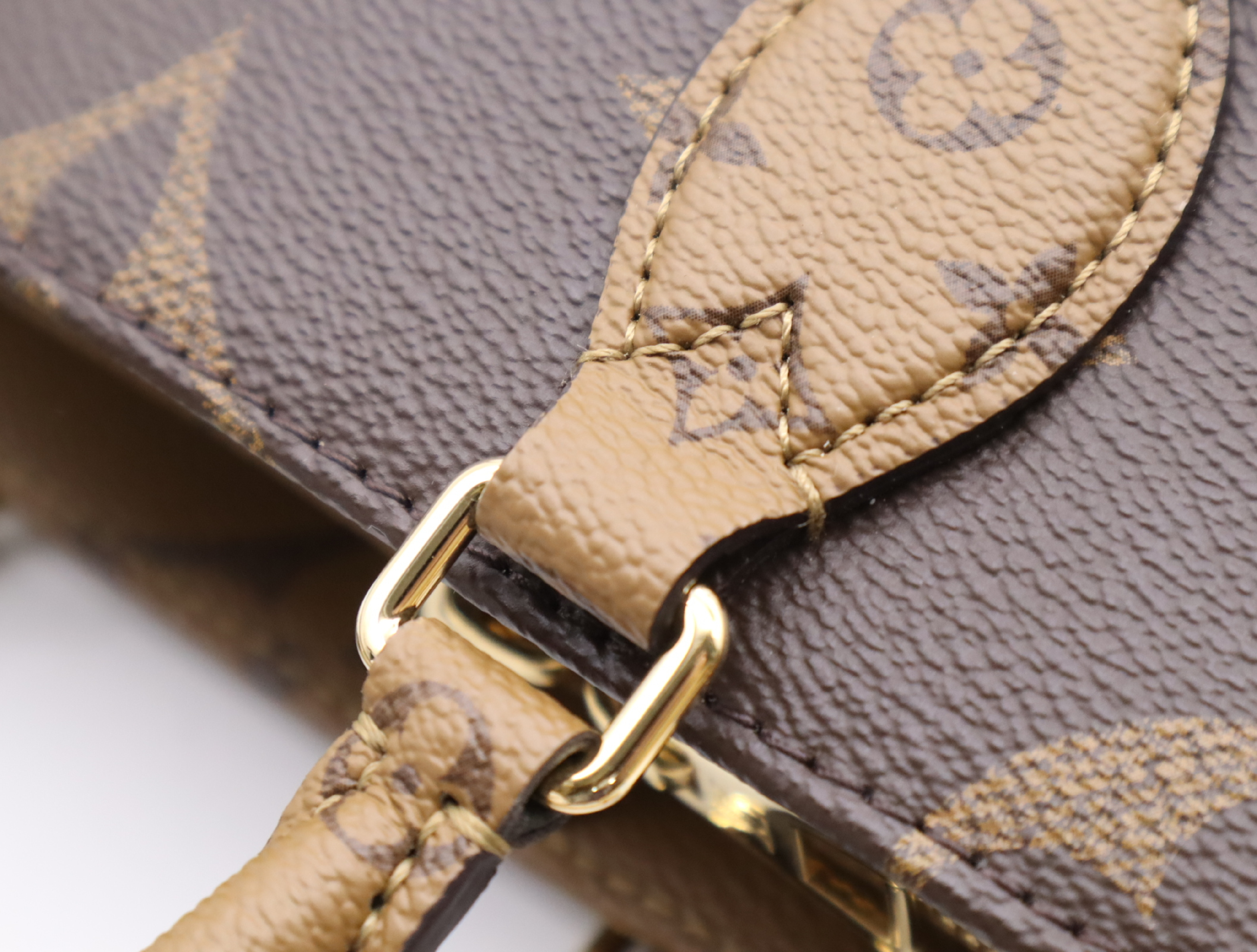 M46653 Monogram Giant Reverse OnTheGo EW Handbag with Shoulder Strap, Coin Case, Dust Bag, and Box — view 10