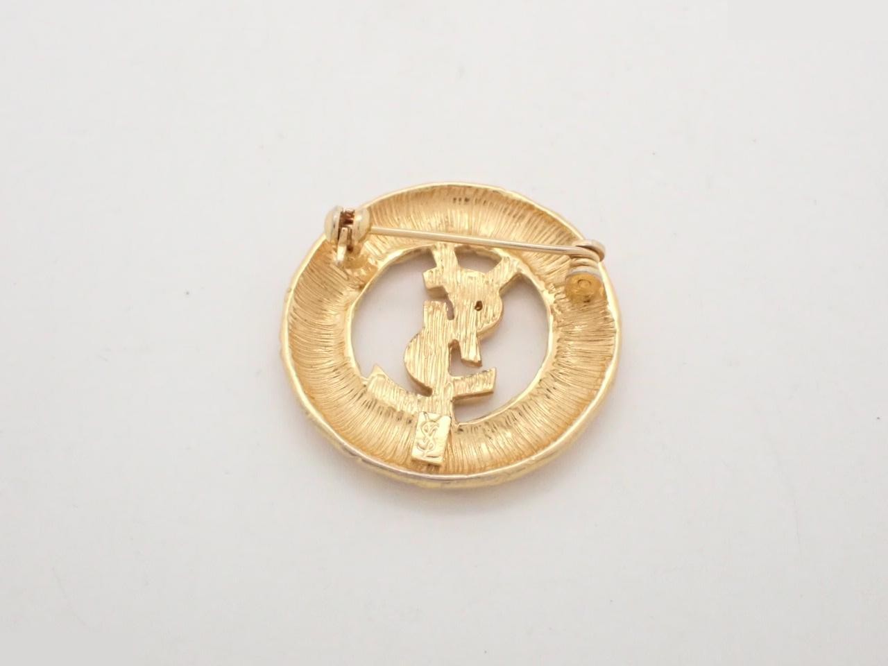 Gold logo brooch — view 2