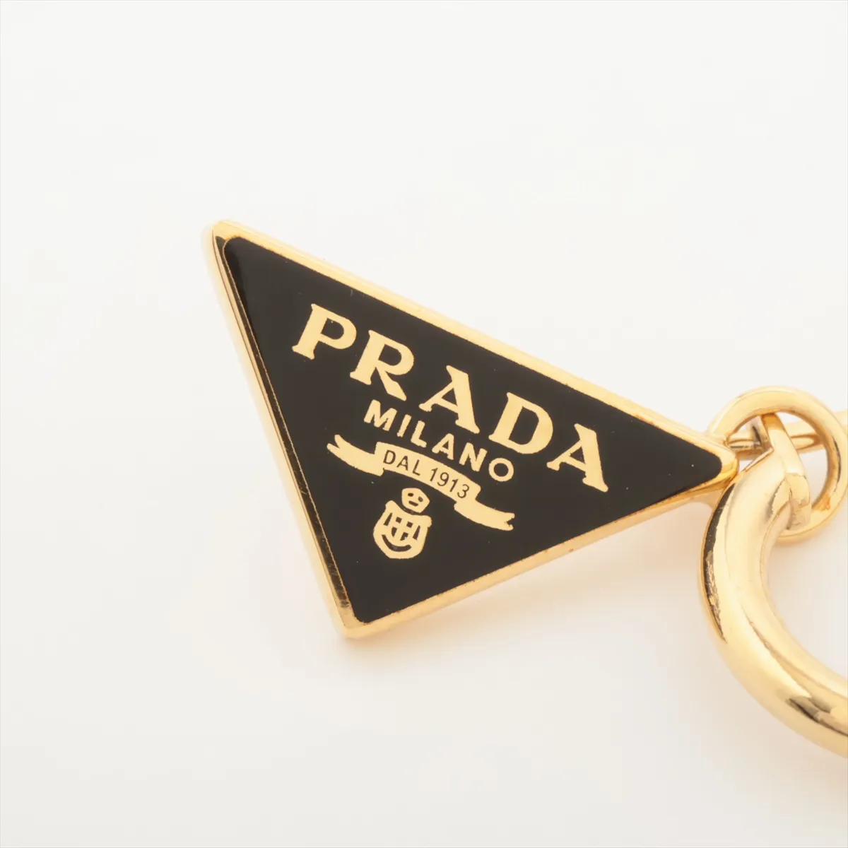 Triangle Logo Earrings (Pair) GP Gold x Black. Shows — view 5