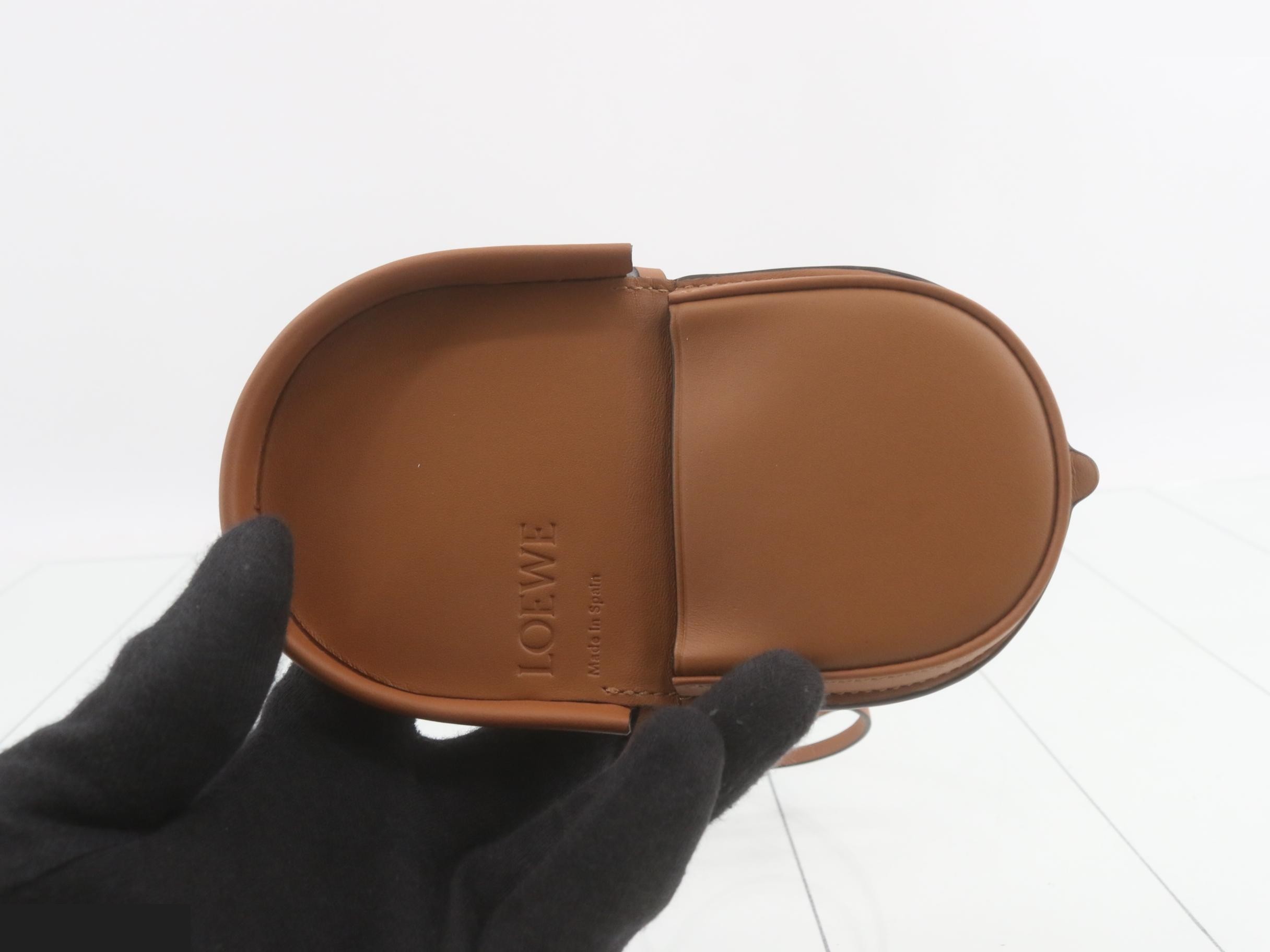 Other lines: Bags & Pouches, Heel Pouch, Mini, Leather, Brown — view 4