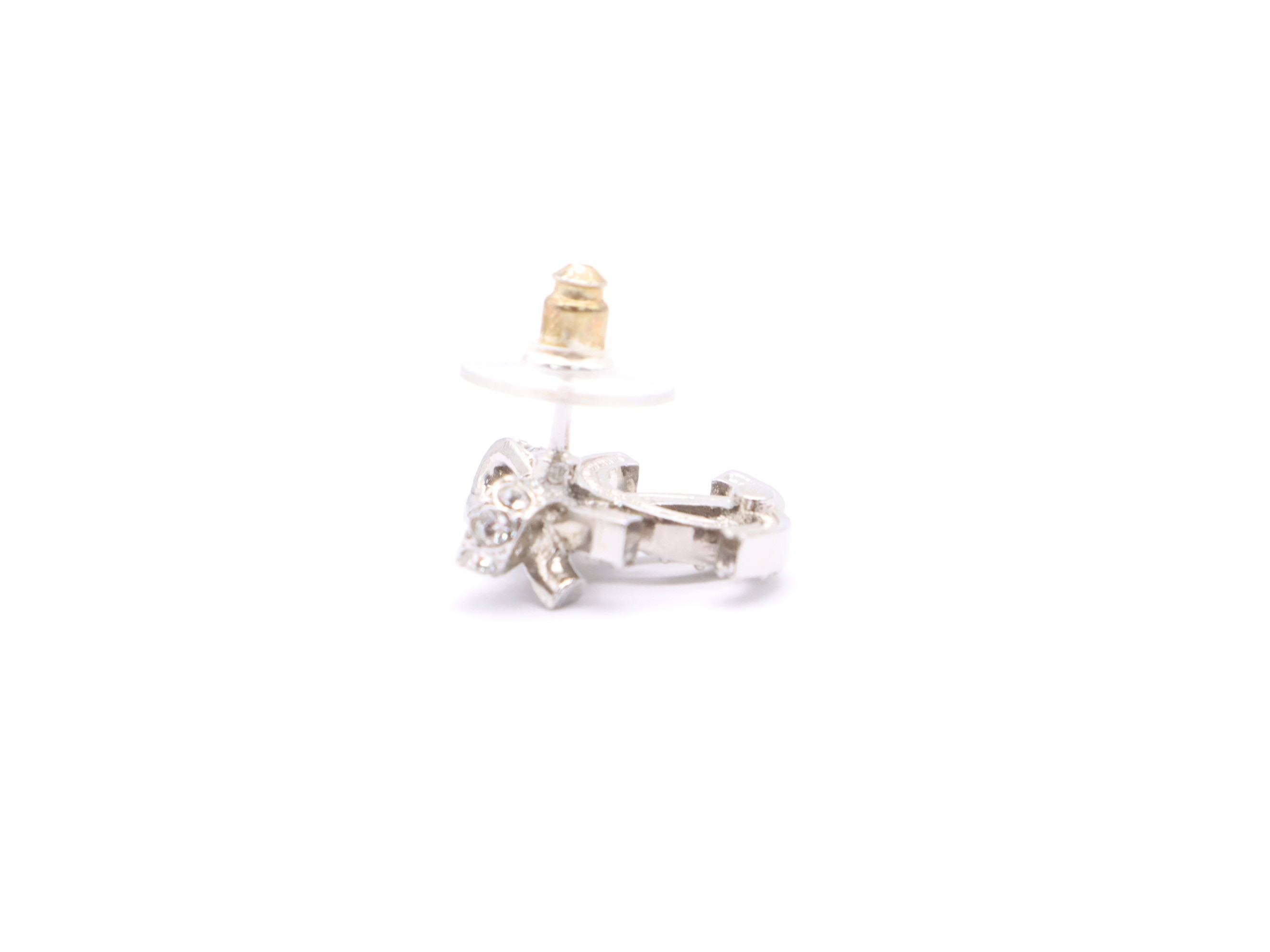 Metal and rhinestone earrings with a Coco Mark ribbon design, silver. — view 3