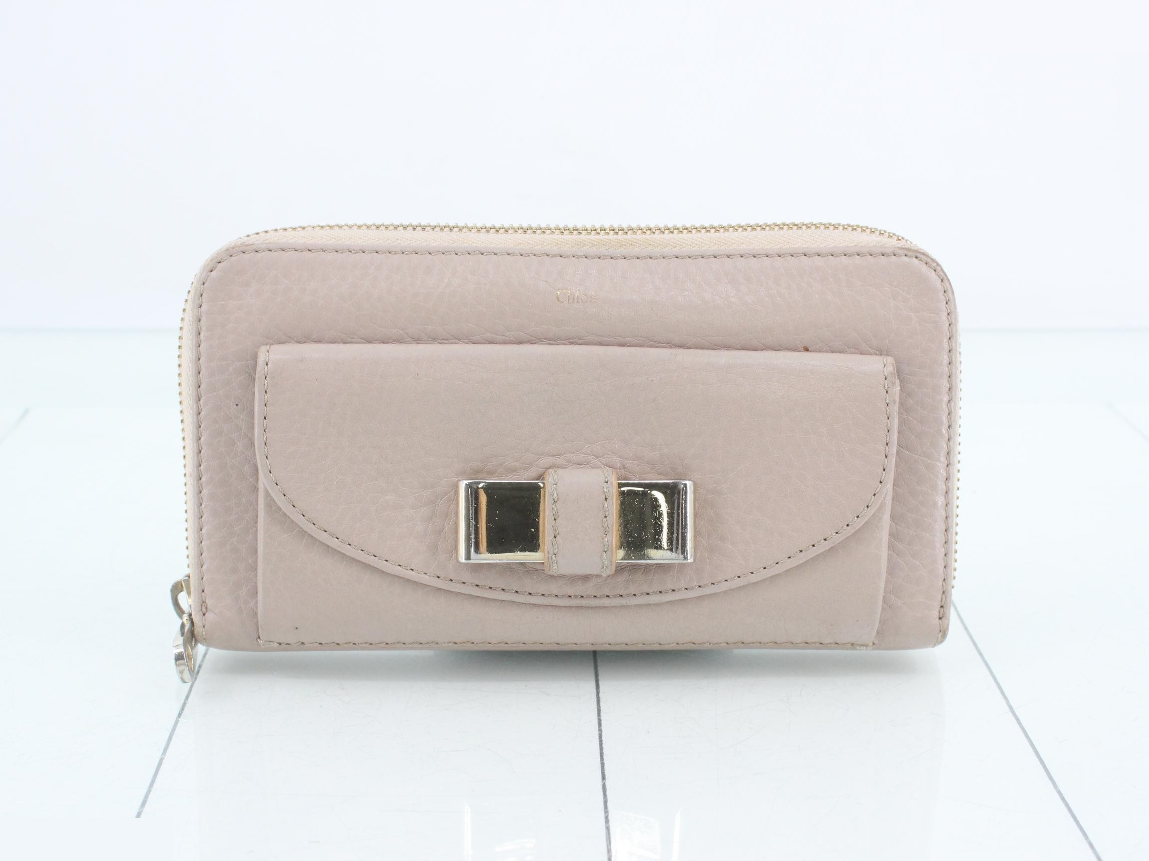 Other lines: Bags & Wallets, Round Zipper Wallet, Pink