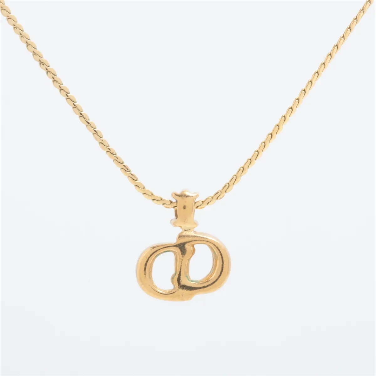 CD logo necklace, gold plated with rhinestones. Shows wear, tarnishing, — view 2