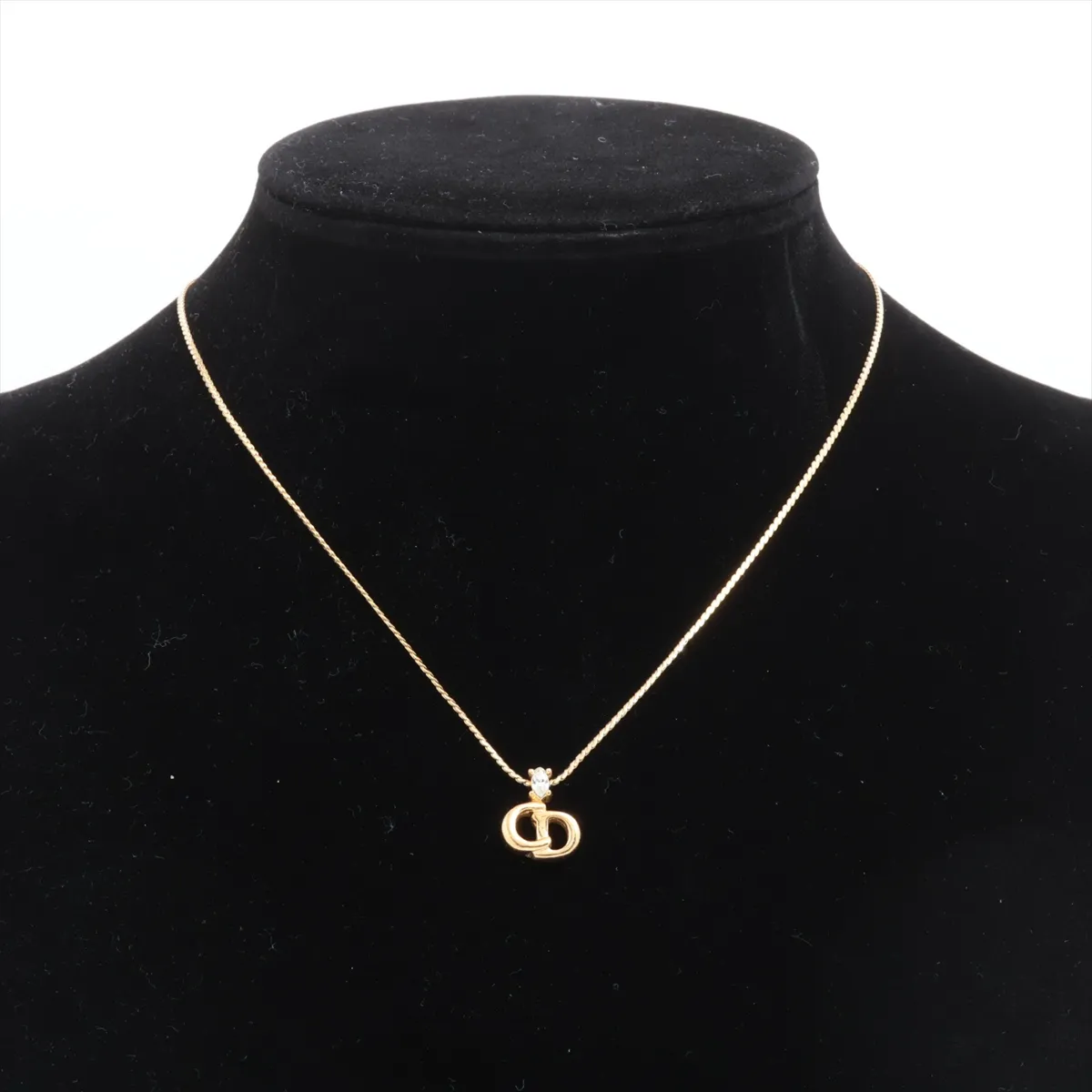 CD logo necklace, gold plated with rhinestones. Shows wear, tarnishing, — view 5