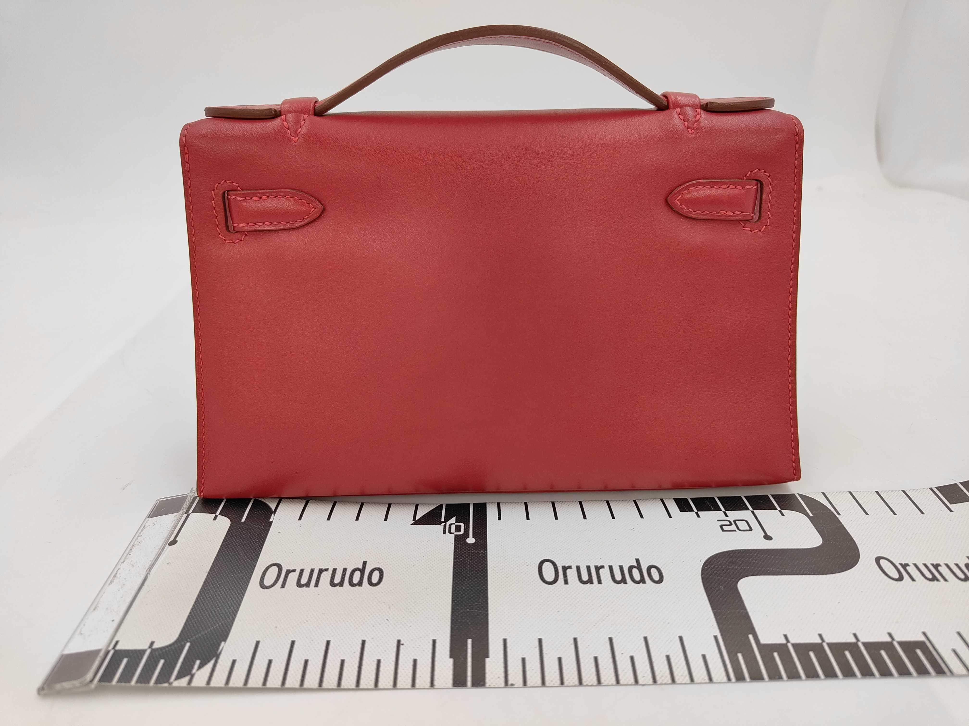 Pochette Kelly handbag, ruby, silver hardware, Veau Swift leather. — view 2