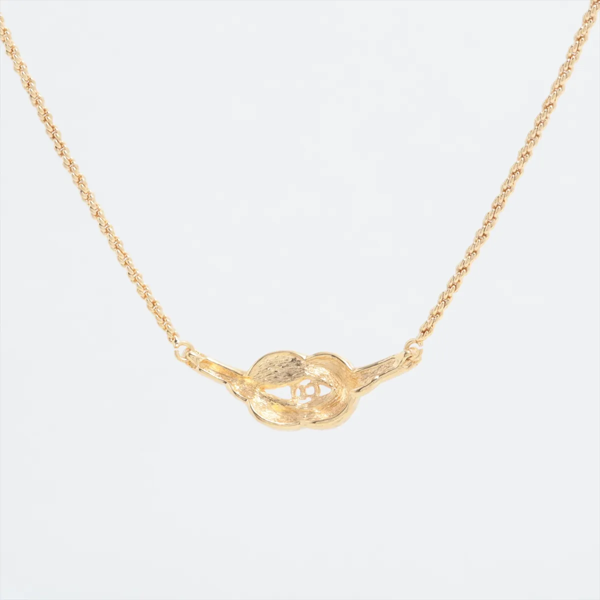 CD logo necklace, gold plated with rhinestones. Shows signs of wear, including — view 2