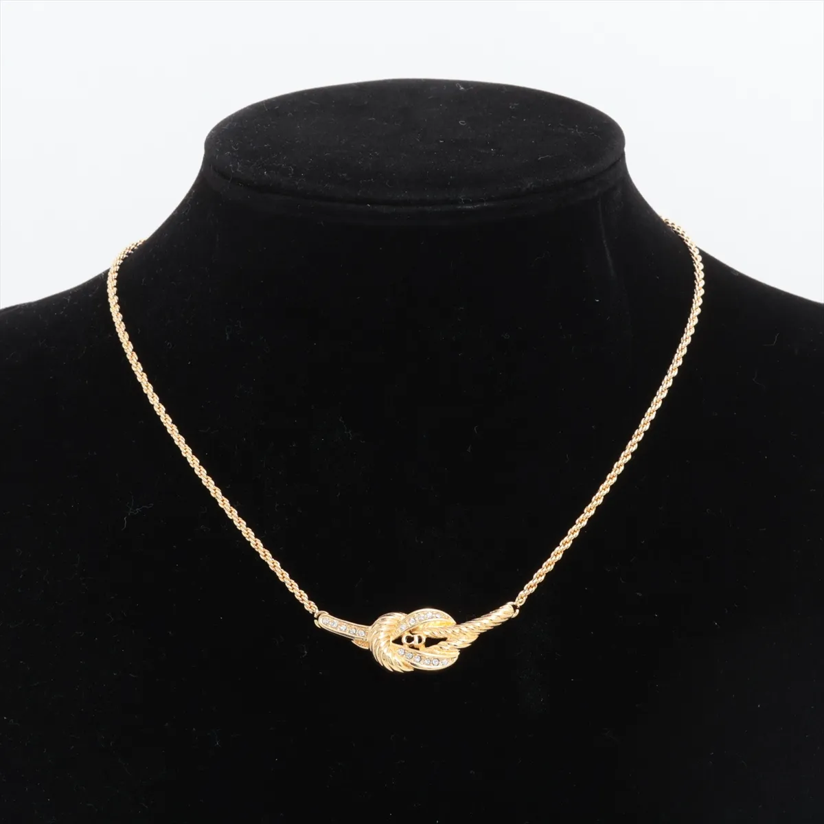 CD logo necklace, gold plated with rhinestones. Shows signs of wear, including — view 5