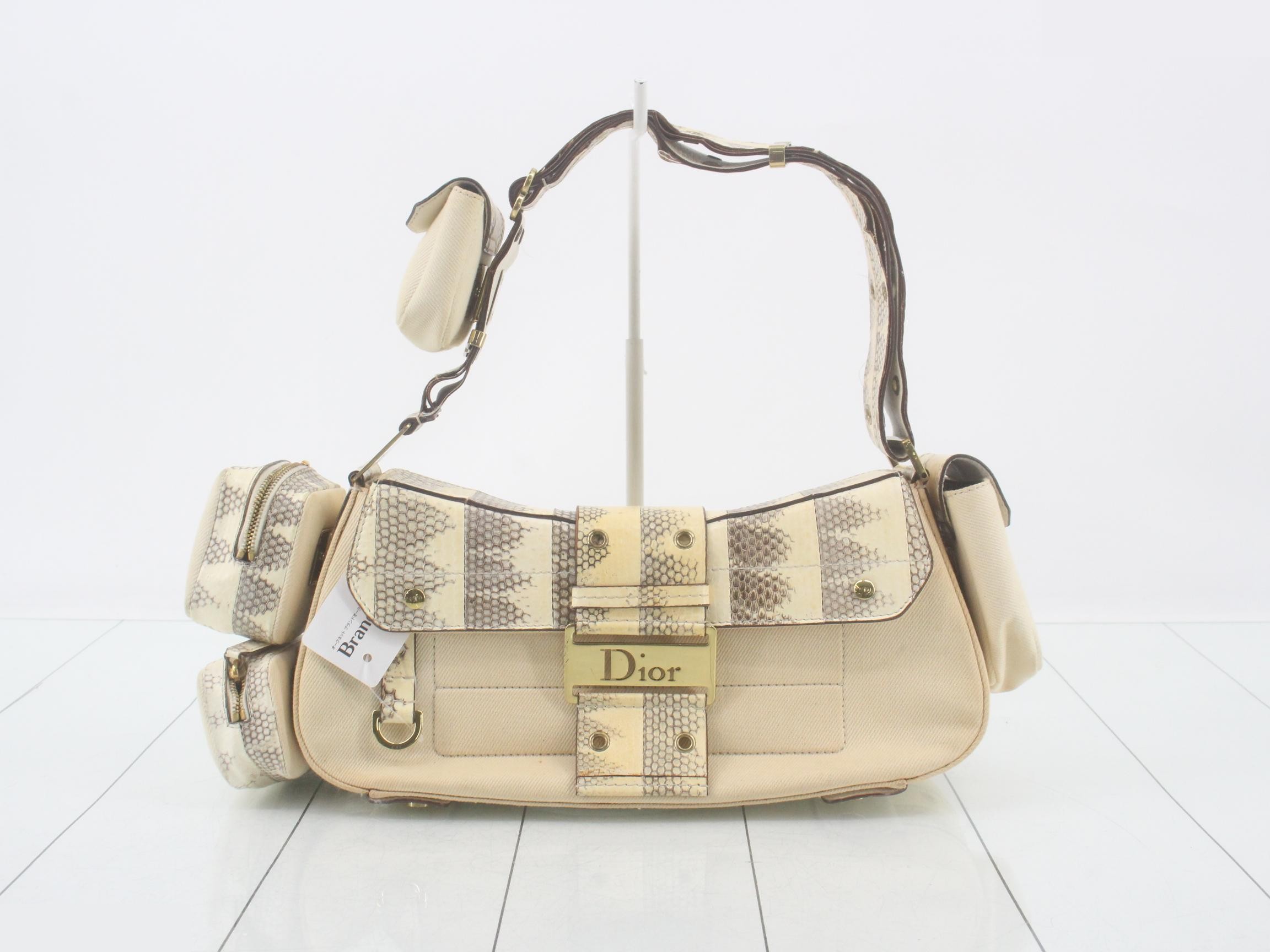 Pouch included. Street chic python design.