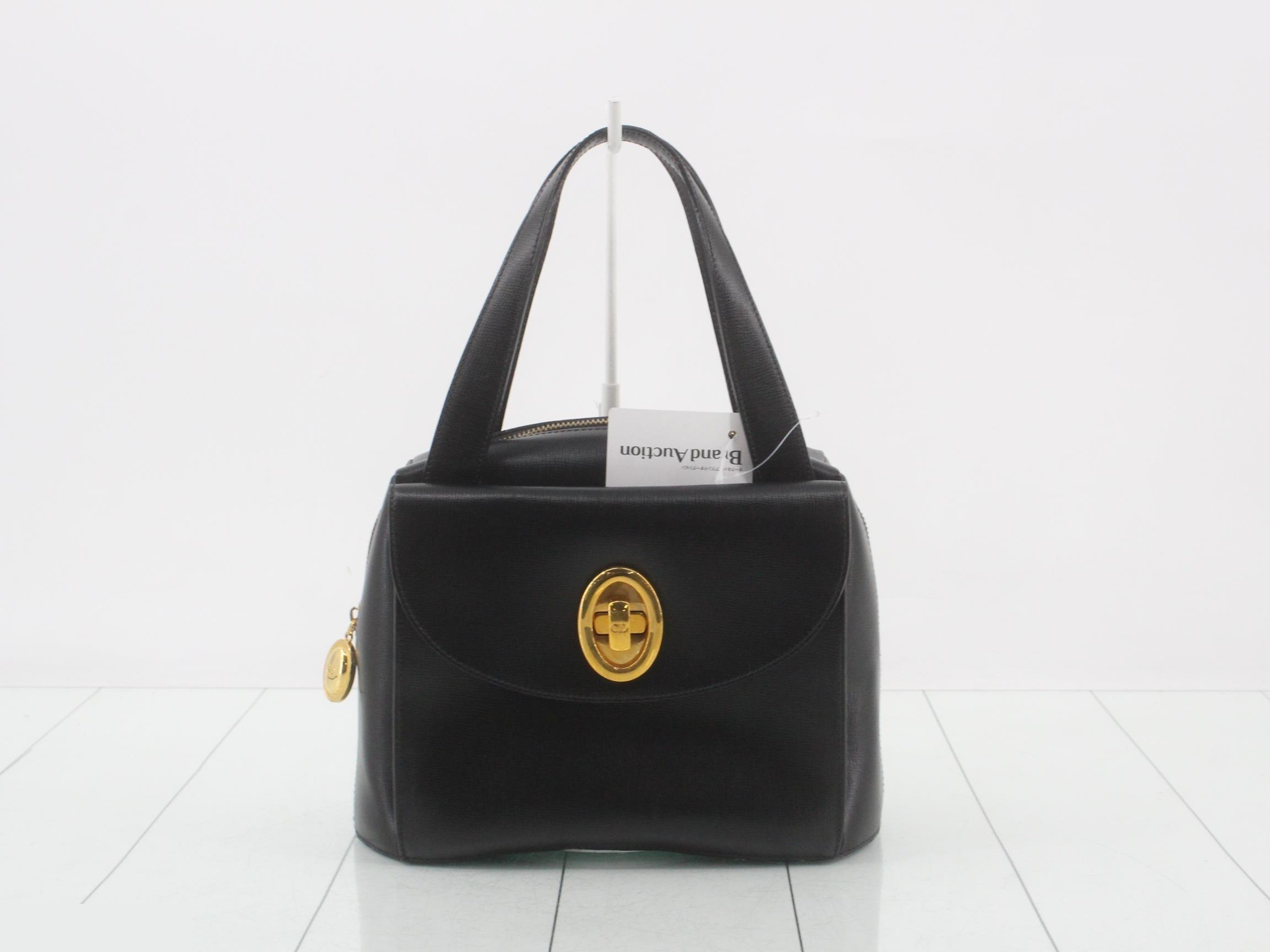 Leather handbag with logo hardware