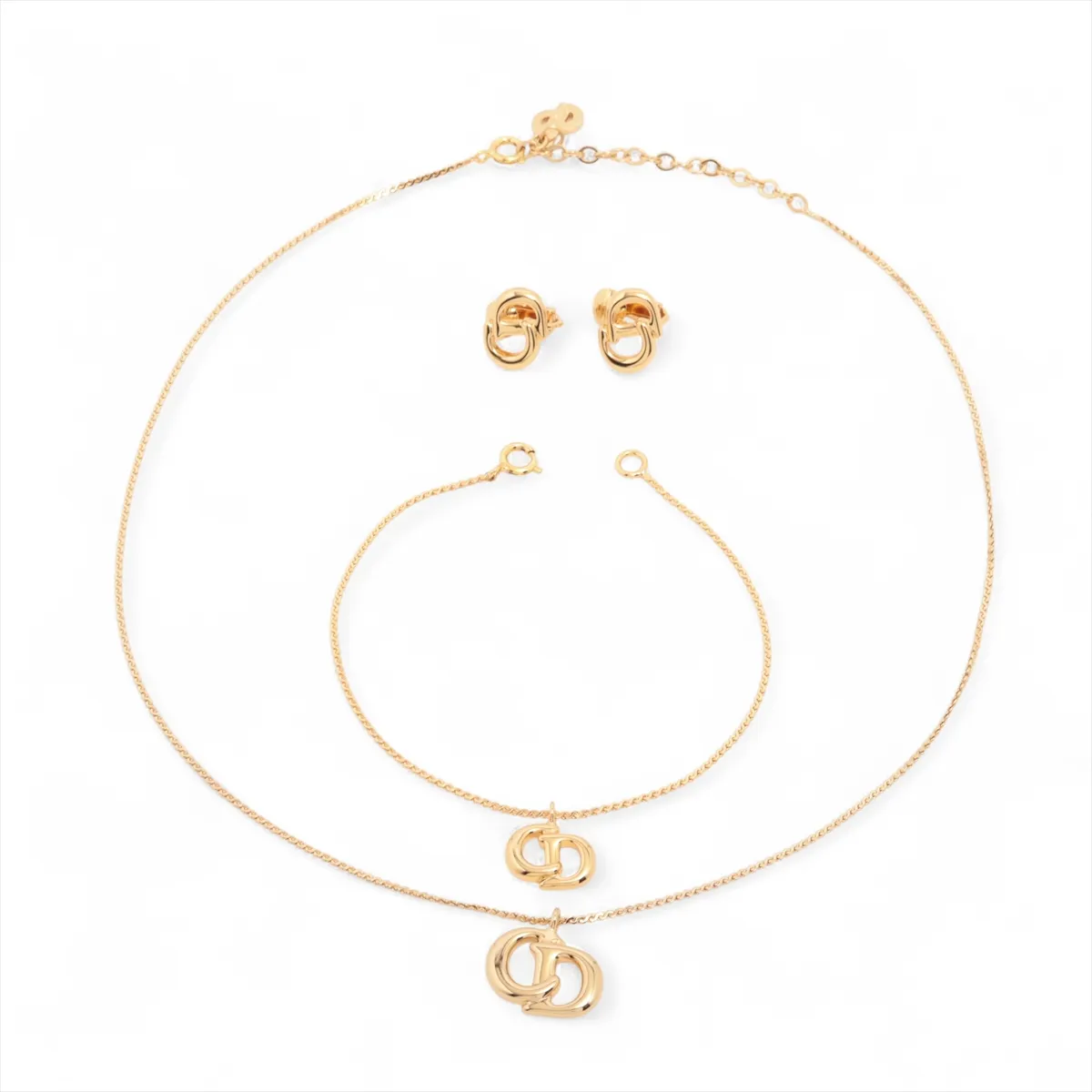 CD logo necklace, GP gold. Shows signs of wear including