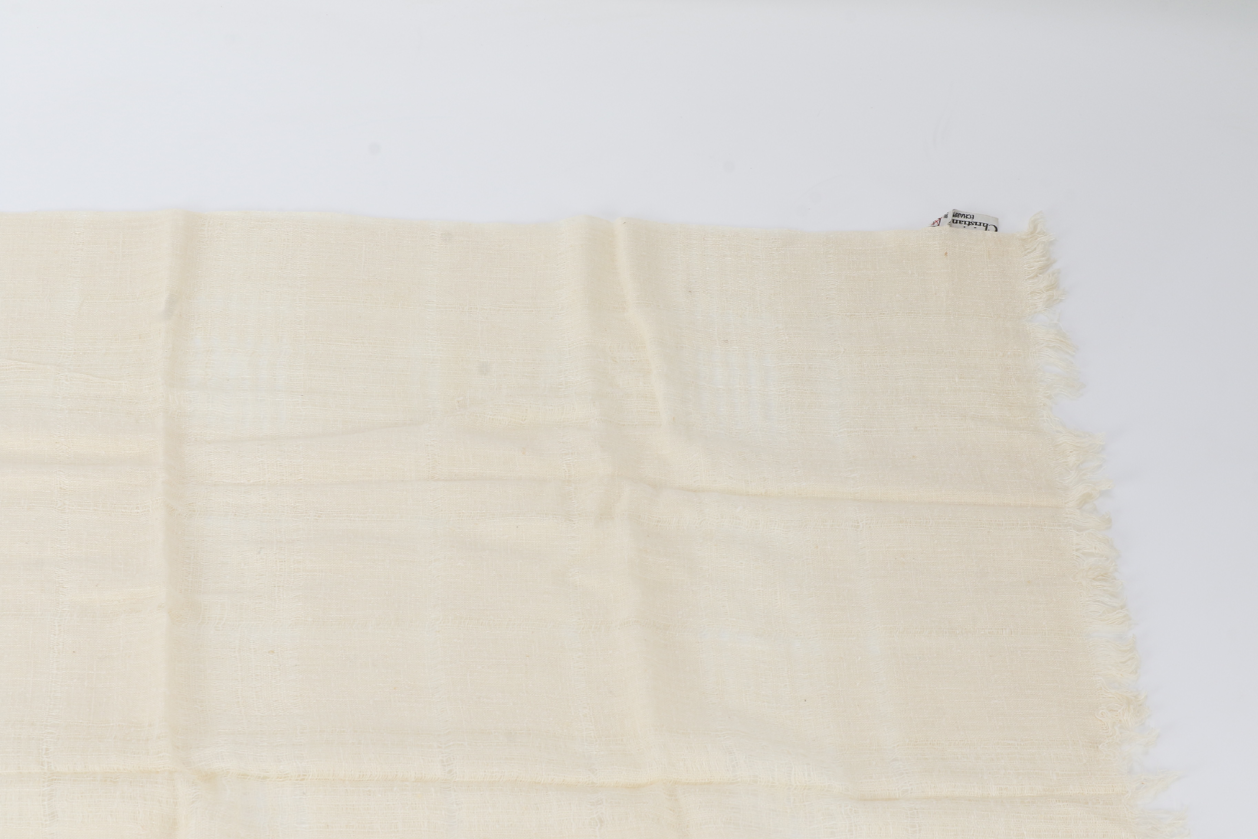 scarf/stole with tag, beige, fringe, and other accessories. — view 2