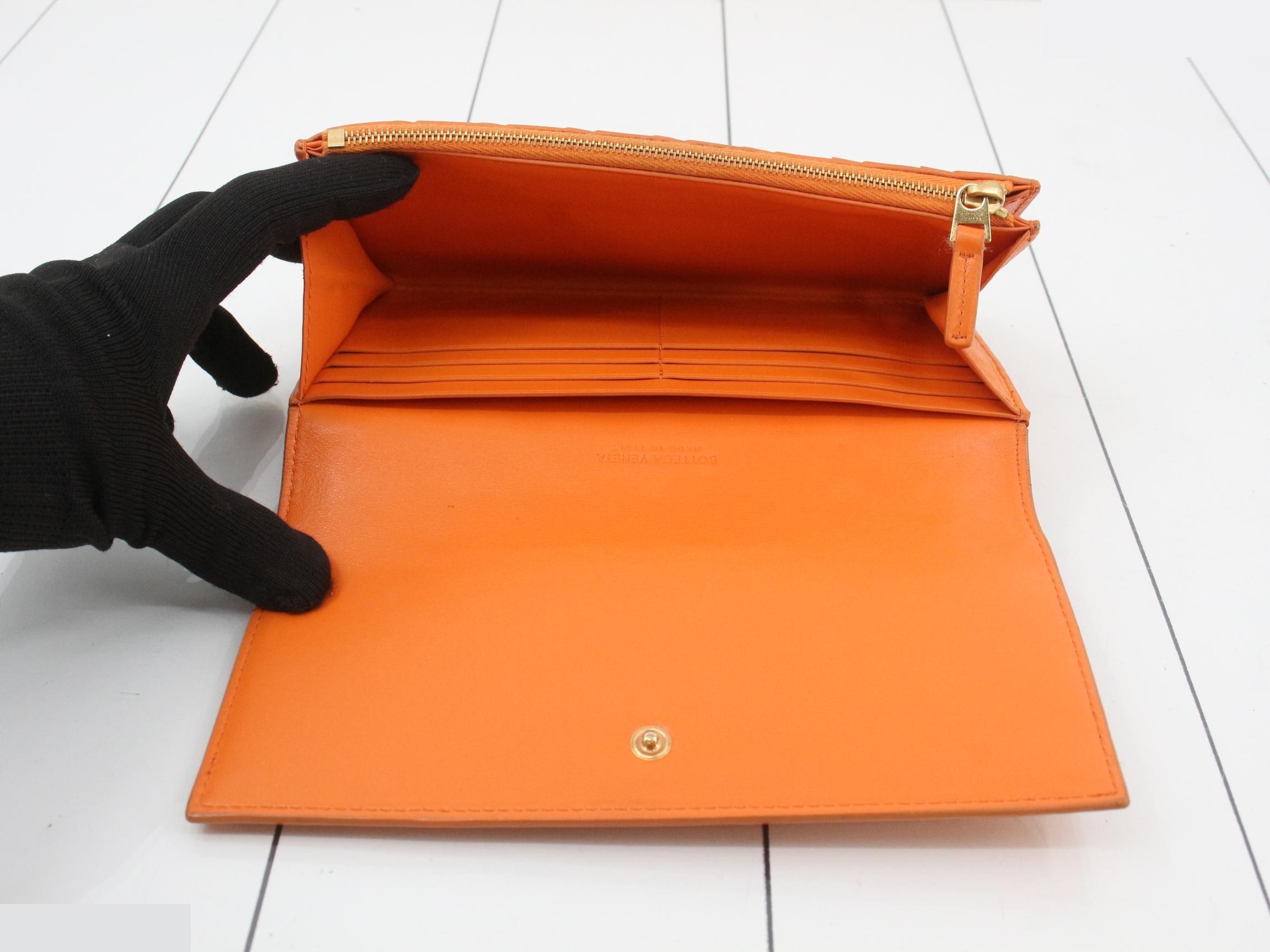 Intrecciato bi-fold long wallet, leather, orange, with box, dust bag, and booklet. — view 4