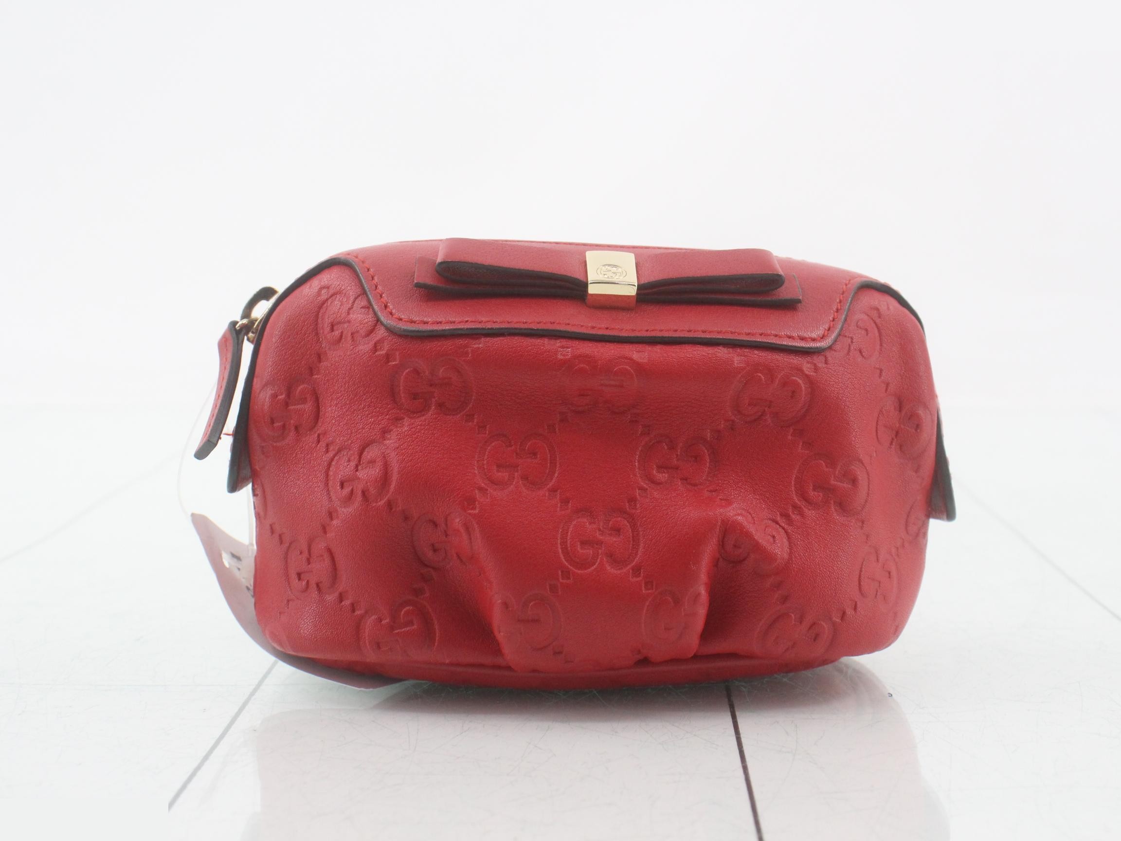 Guccissima (bag) and pouch, red