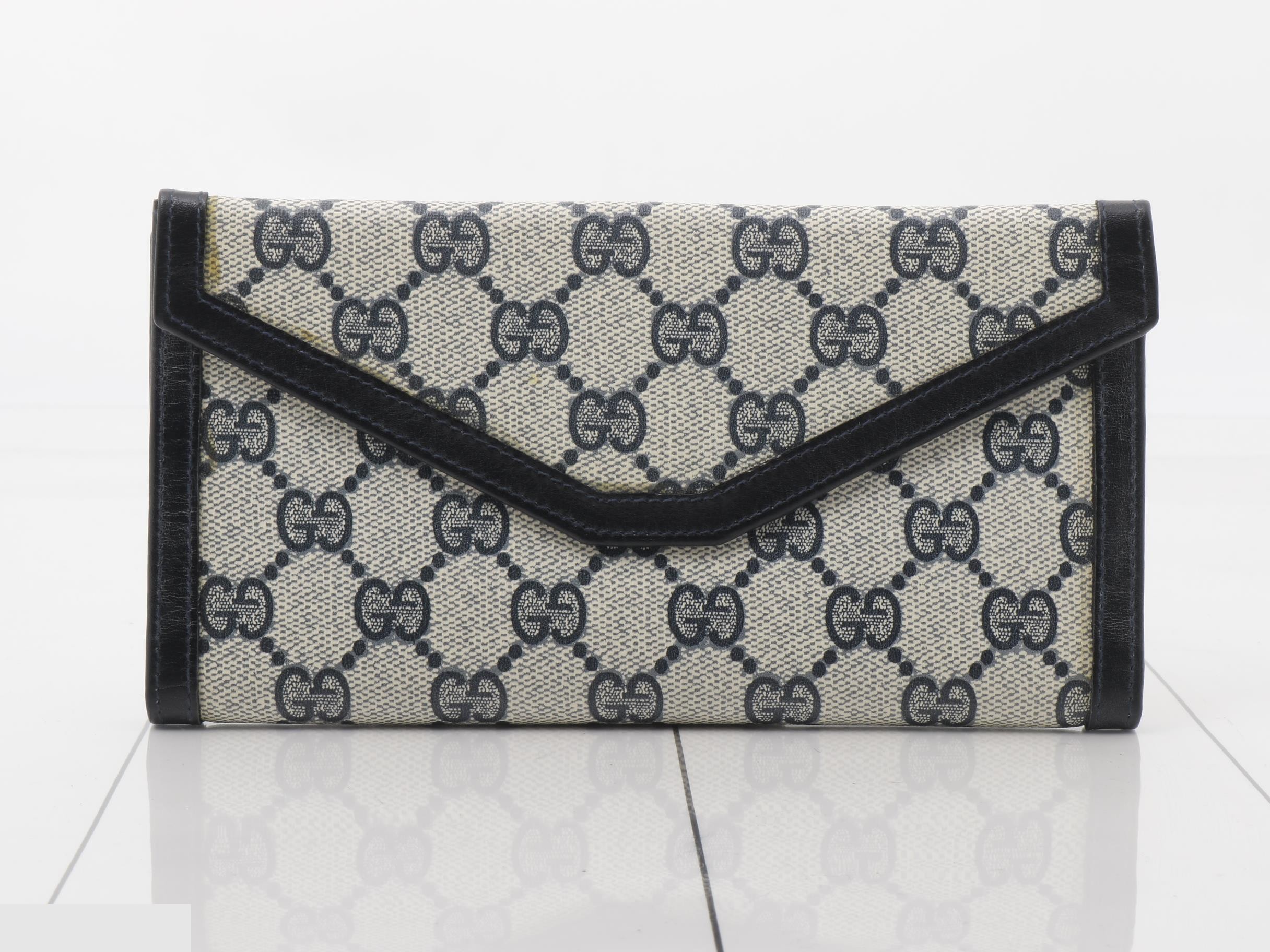 Vintage Gucci bi-fold wallet, navy, gold hardware — view 2