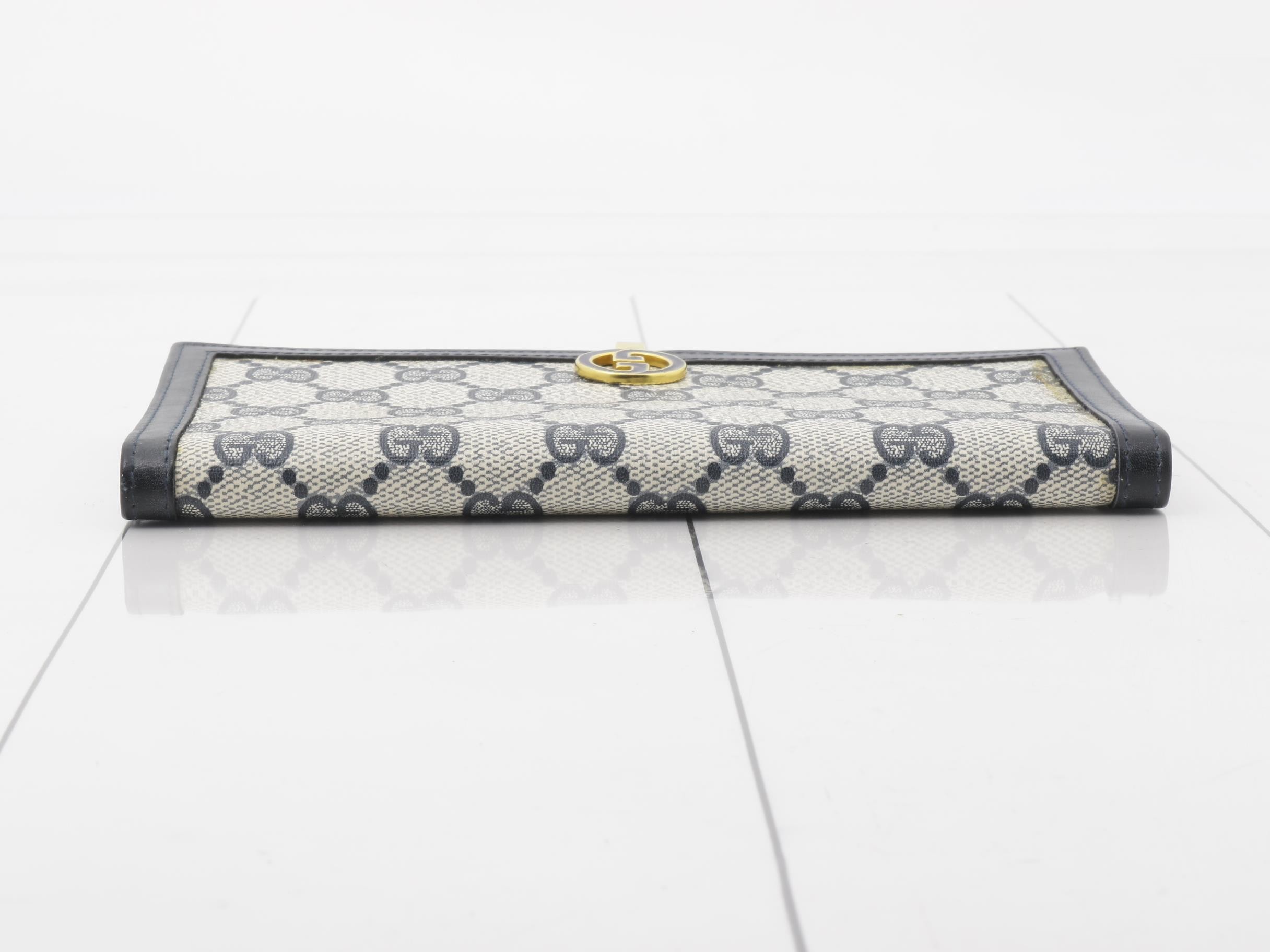 Vintage Gucci bi-fold wallet, navy, gold hardware — view 3