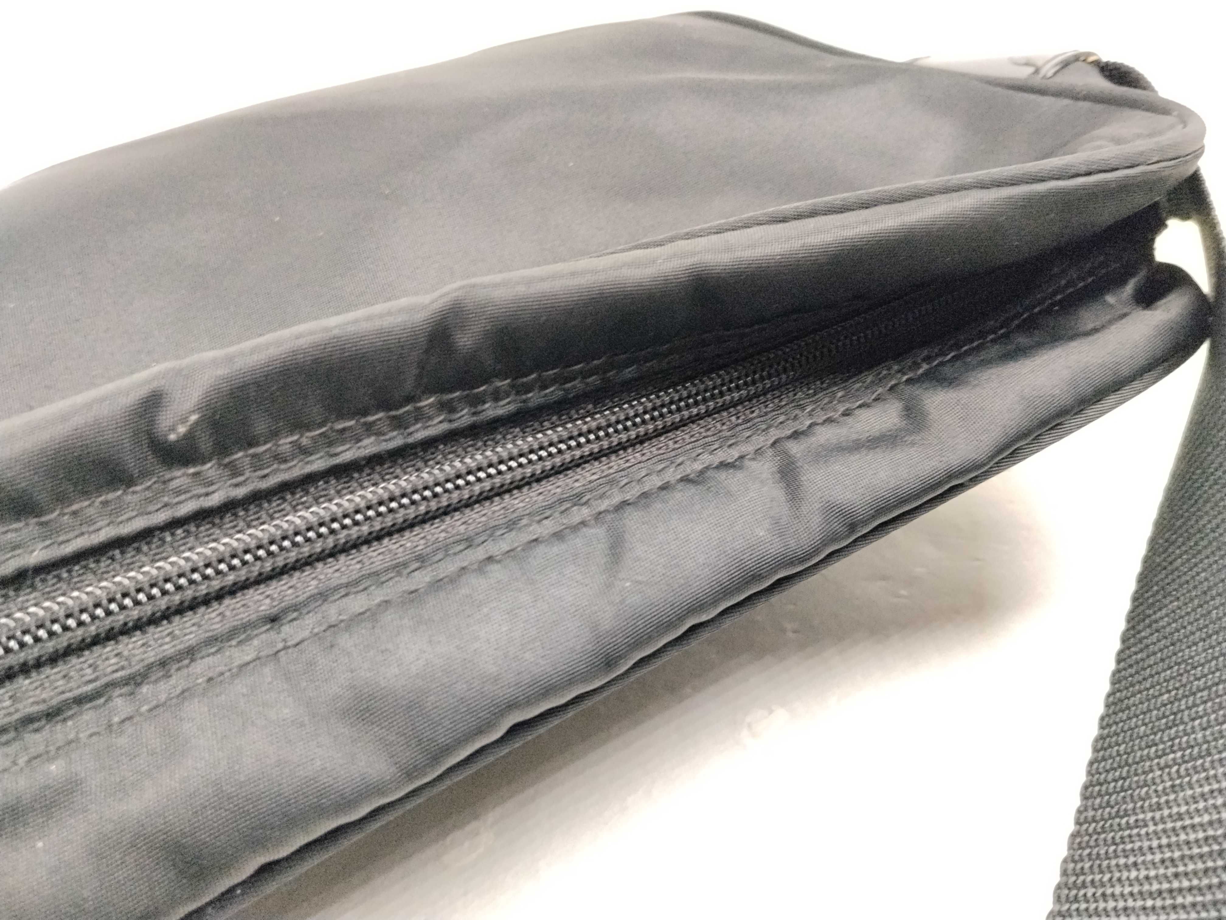 Nylon Shoulder Bag / Shoulder bag with some loose threads on the outside. — view 8