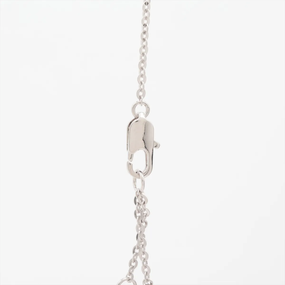 logo necklace, metal and rhinestones, silver. Shows wear, tarnishing, and discoloration. — view 3