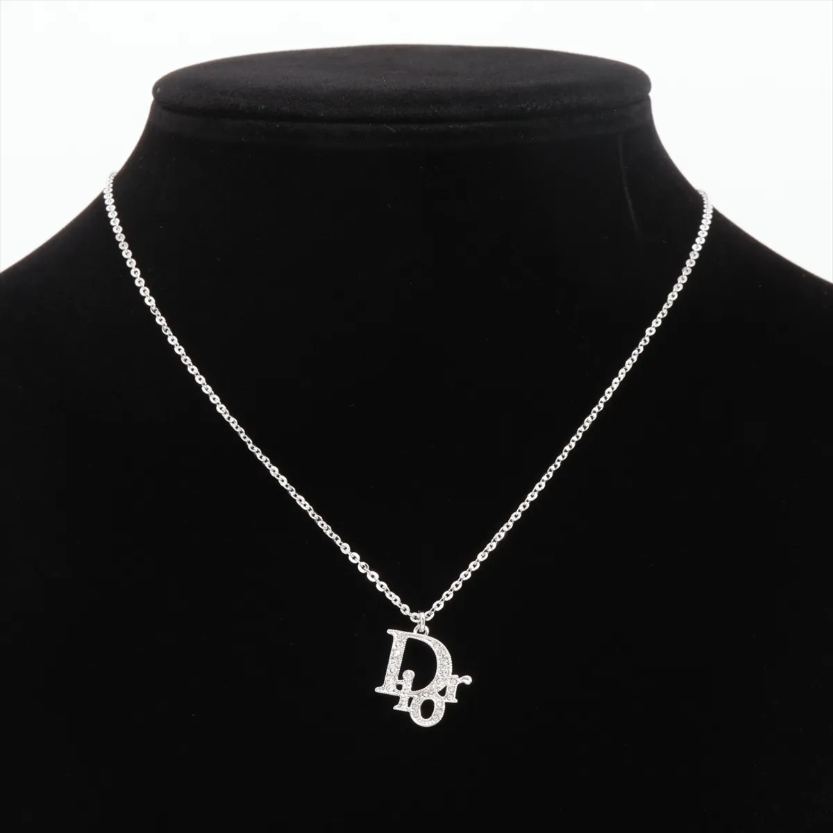 logo necklace, metal and rhinestones, silver. Shows wear, tarnishing, and discoloration. — view 5