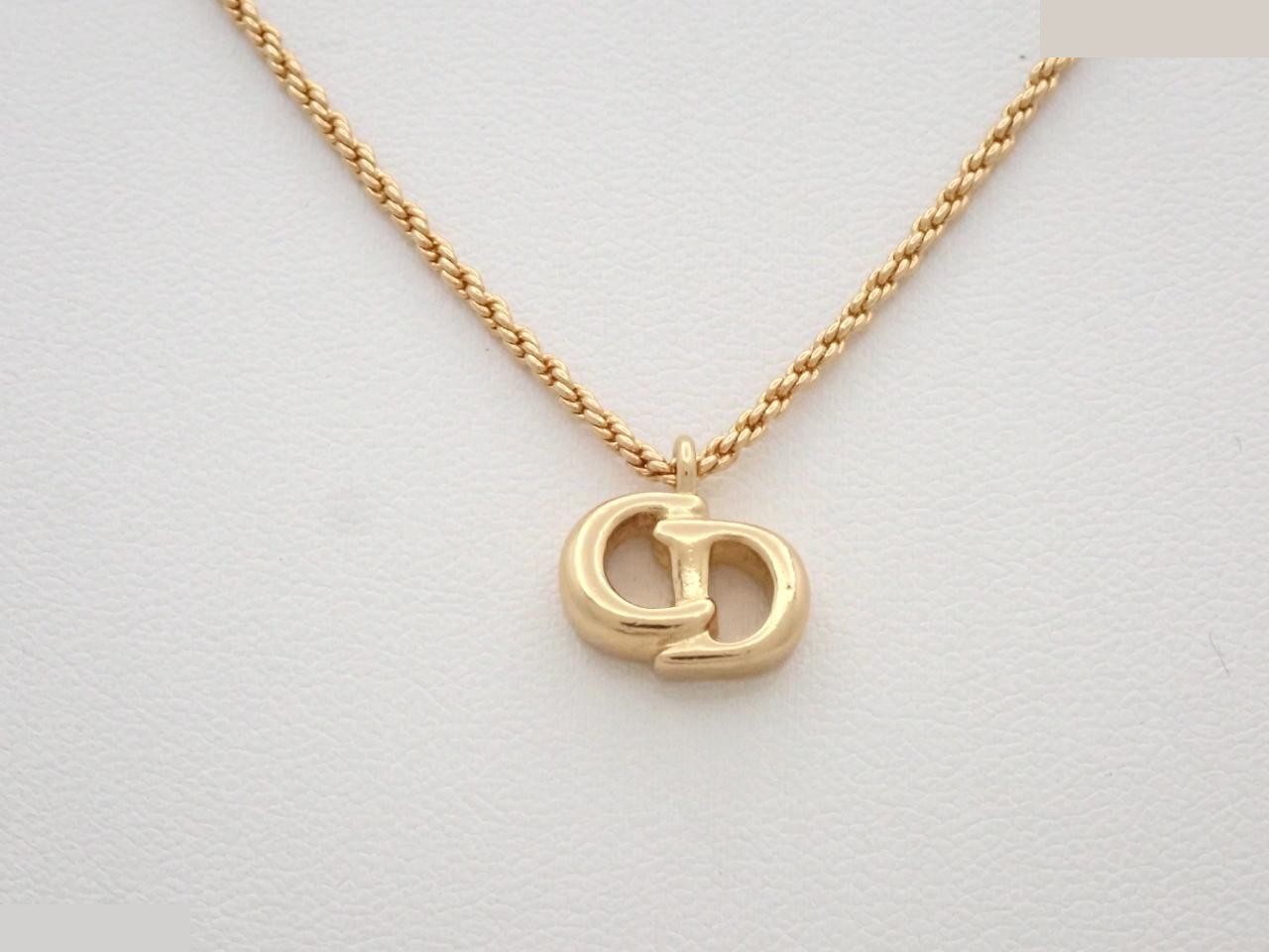 CD logo necklace/pendant; chain approximately 42cm.