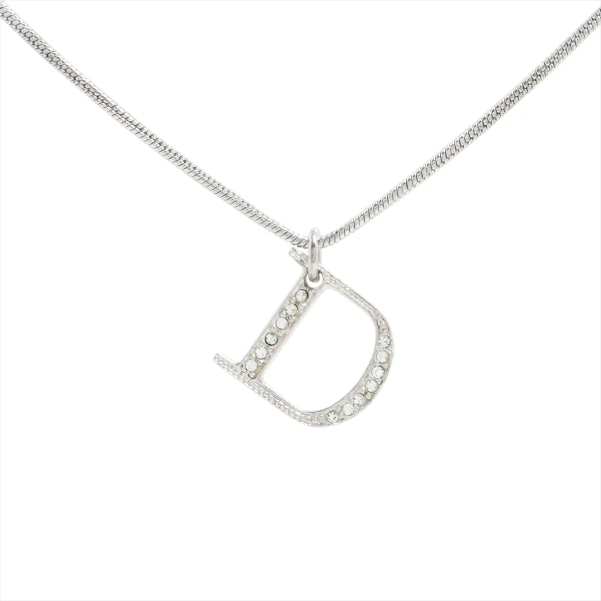 D-logo necklace, metal and rhinestones, silver. Shows signs of wear,