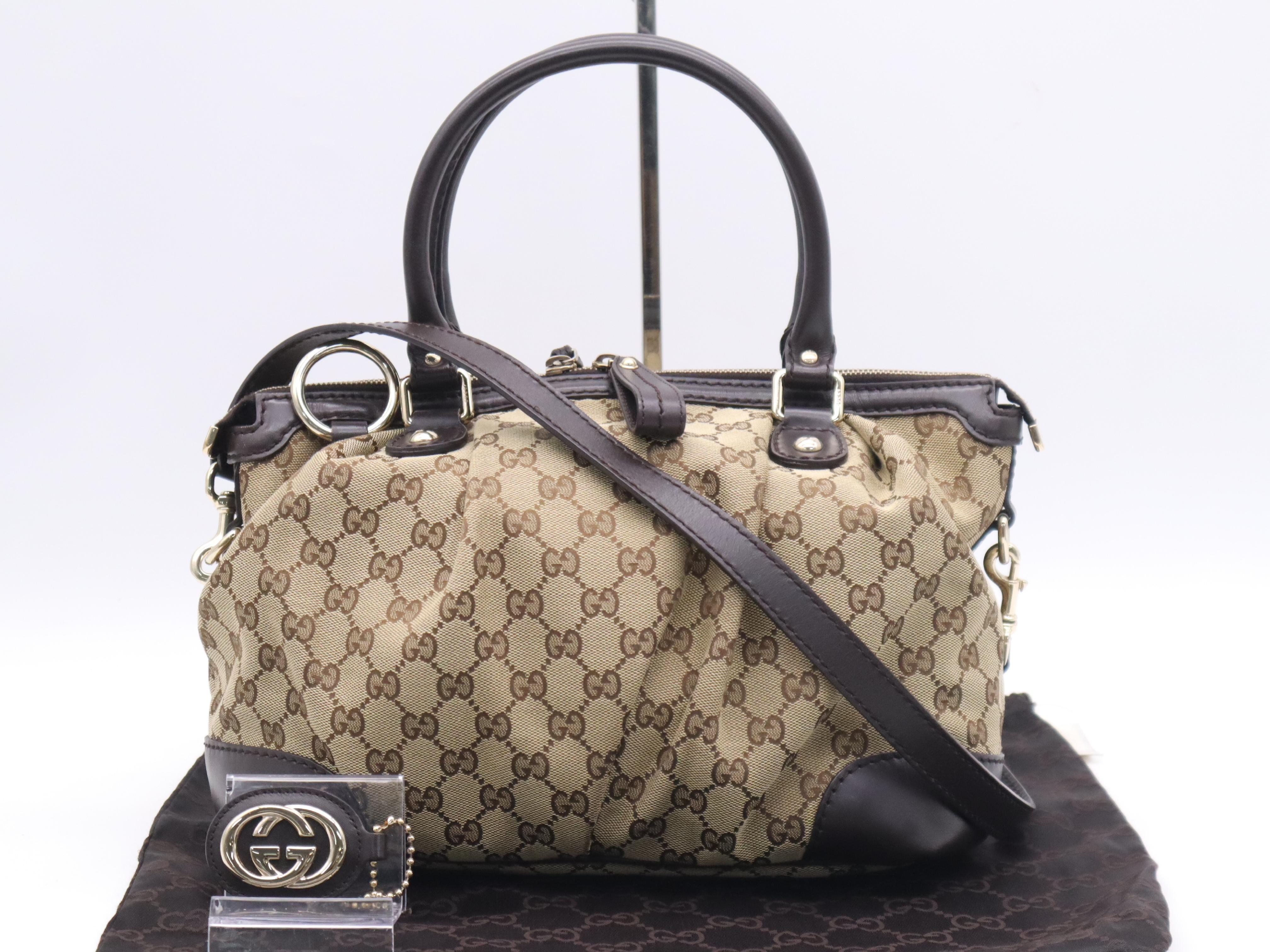 247902 GG Canvas Sukey 2-way Handbag, Beige/Brown, with Shoulder Strap, Dust Bag, and Charm.