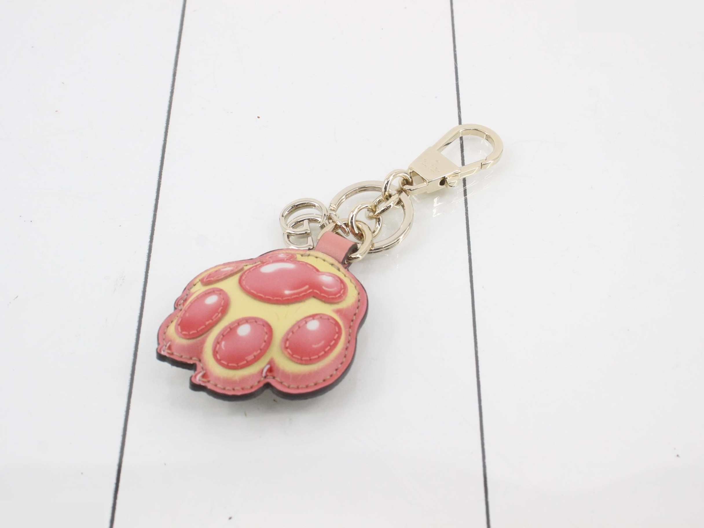 Unused paw print key ring, with box and dust bag.