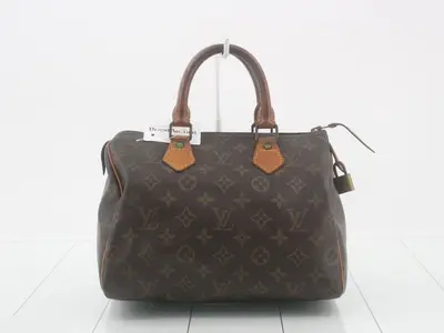 Monogram Speedy bag; serial number faded, heavily deteriorated.