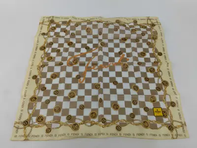 handkerchief scarf with sticker, FF Zucca big logo, chain, and other accessories.