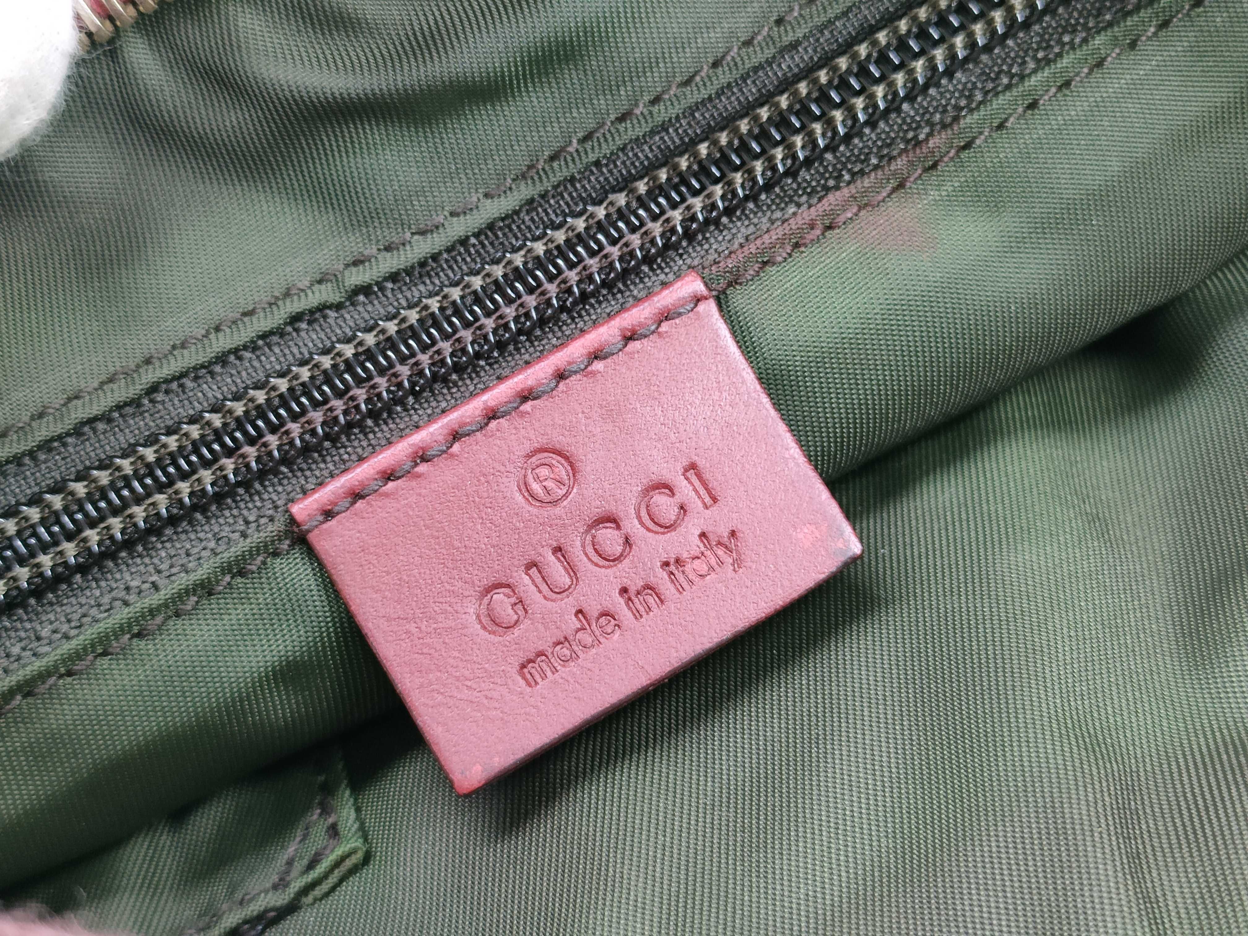 GG Canvas Shoulder Bag with GG Pattern, Webbing Strap, and Leather Trim. — view 10