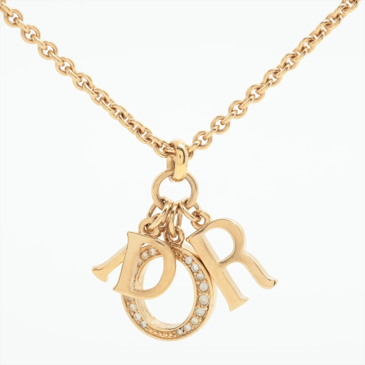 logo necklace, GP gold. Shows signs of wear,