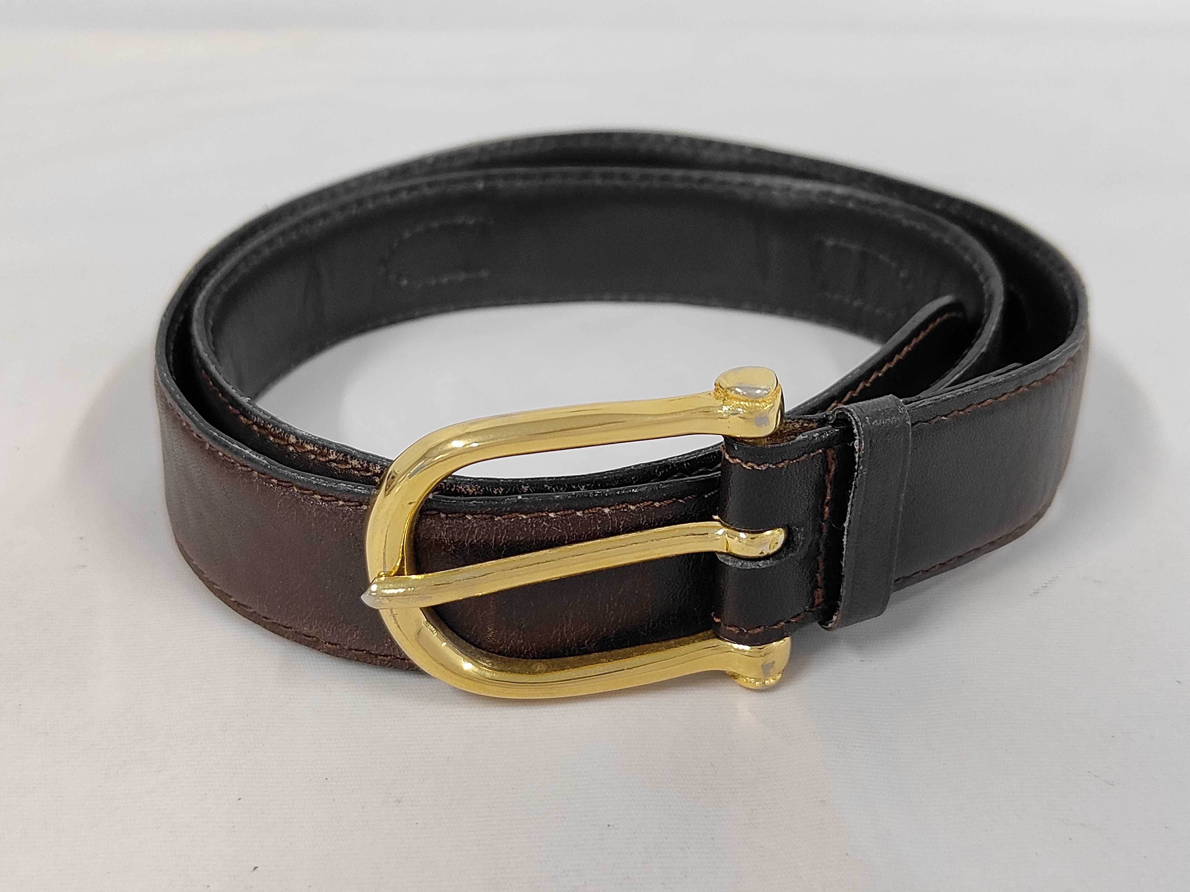 leather belt with carriage-style buckle.