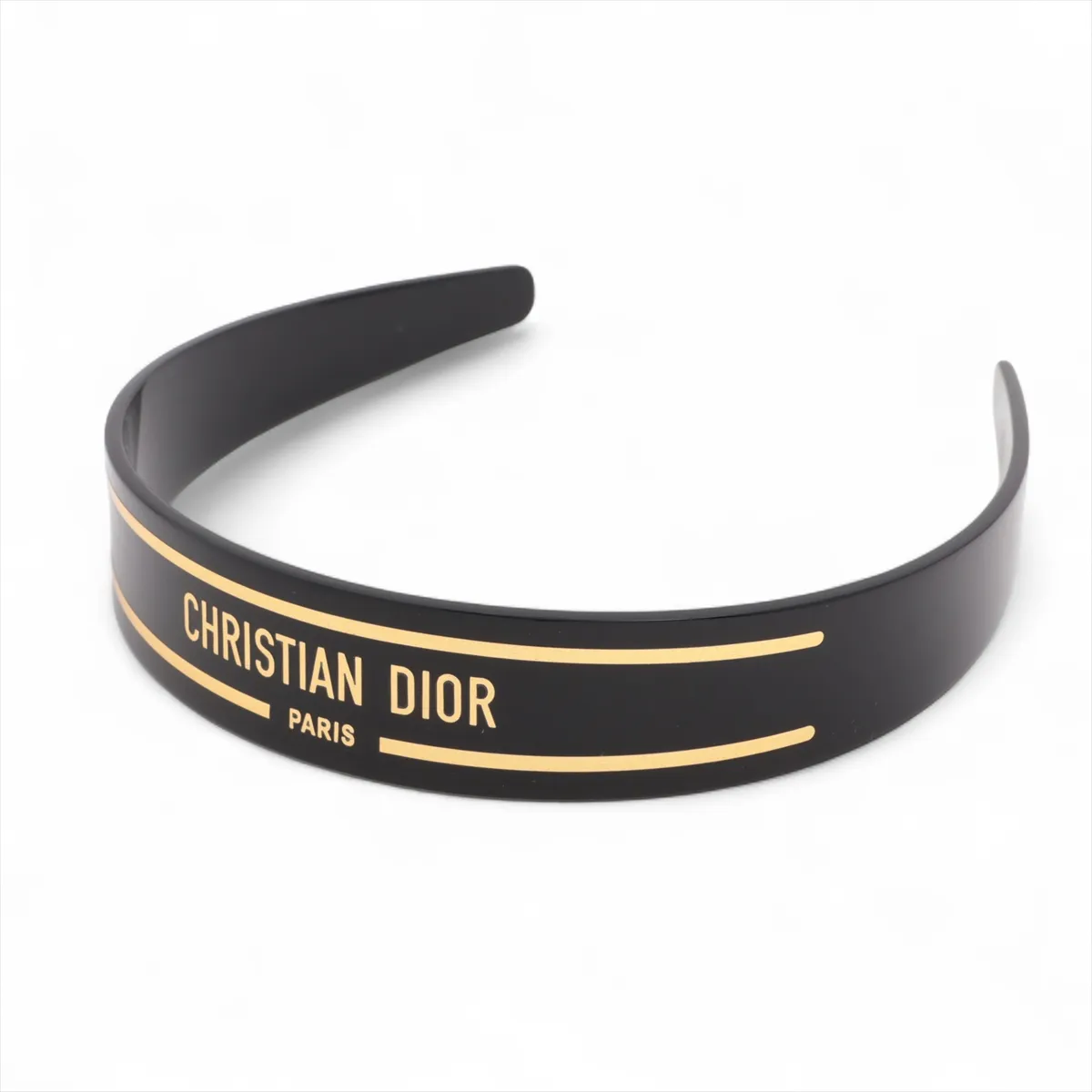 logo headband, plastic, black and gold. Shows signs of wear,