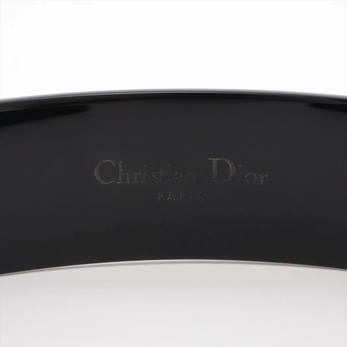 logo headband, plastic, black and gold. Shows signs of wear, — view 3