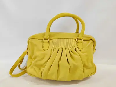SG-Plong? gathered leather handbag, yellow.