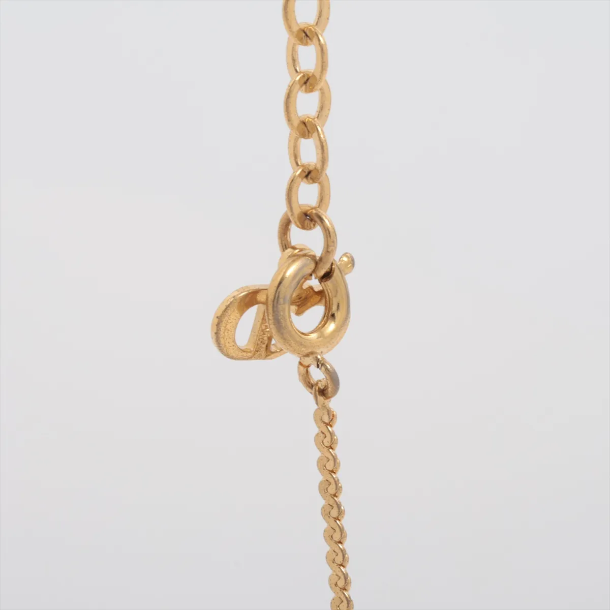 CD logo necklace, gold plated with rhinestones. Shows signs of wear, tarnishing, — view 3