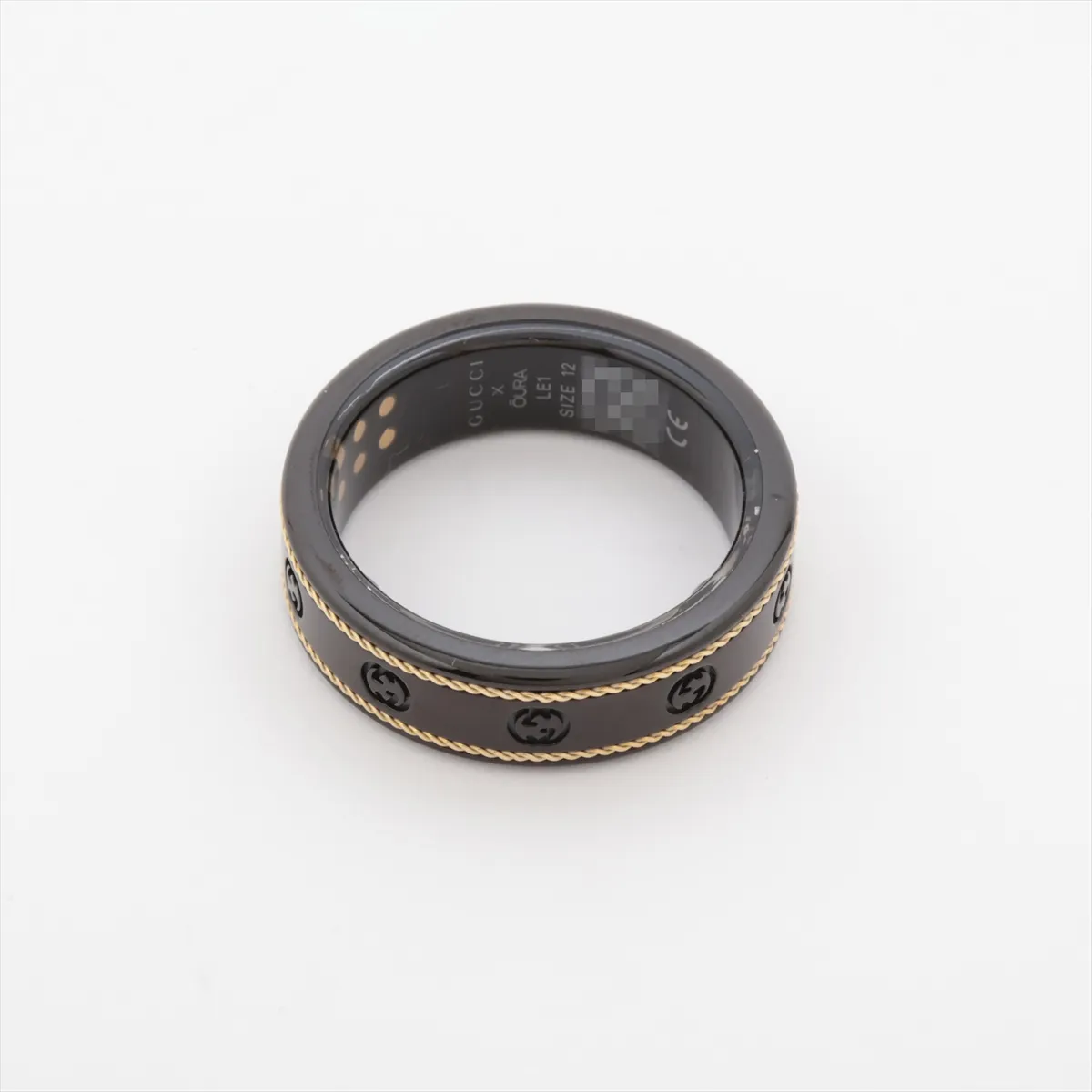 x Aura Interlocking G Ring, Size 12, Titanium, Black x Gold. Shows — view 2